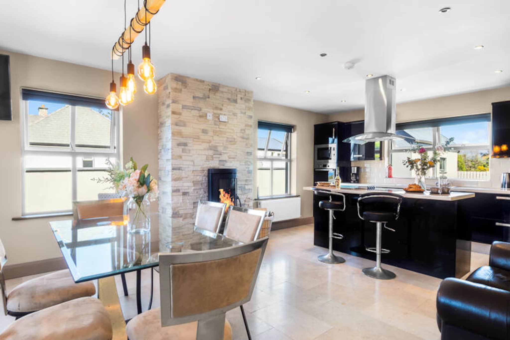 On the rugged shores of Connemara, where the Atlantic waves meet the untamed beauty of Ireland’s west coast, this charming house in Renvyle offers a tranquil escape for those seeking serenity and adventure. Surrounded by breathtaking landscapes, from rolling hills to dramatic cliffs, this property invites you to immerse yourself in the natural splendor of the Emerald Isle. Whether you’re waking up to the sound of the ocean or enjoying the crisp evening air in the garden, every moment here feels like a retreat into nature’s embrace. \n\nInside, the house boasts a spacious 204 m² layout with three well-appointed bedrooms, comfortably accommodating up to six guests. The open-plan kitchen is fully equipped with modern appliances, including a refrigerator, microwave, oven, and dishwasher, making it ideal for preparing hearty meals after a day of exploration. Relax by the fireplace in the cozy living area or unwind on the terrace with a cup of tea as you take in the serene surroundings. Additional amenities such as Wi-Fi, central heating, a washing machine, dryer, and on-site parking ensure a comfortable and hassle-free stay. \n\nRenvyle’s location is a gateway to some of Ireland’s most iconic attractions. Discover the nearby beaches, perfect for a leisurely stroll or a refreshing dip. Explore Connemara National Park, with its scenic trails and abundant wildlife, or visit Kylemore Abbey, a stunning lakeside castle steeped in history. For those who love outdoor activities, the area offers opportunities for hiking, fishing, and cycling, all set against the backdrop of Ireland’s majestic landscapes. \n\nWhether you’re seeking a peaceful getaway or an active holiday, this Renvyle retreat provides the perfect base to create unforgettable memories in one of Ireland’s most enchanting regions.