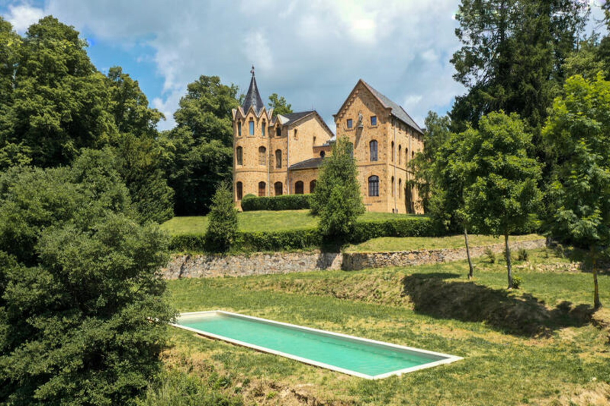 Amidst the rolling hills of Catalonia, Castell de Villavecchia offers a serene escape where history and nature intertwine. This exclusive estate, nestled at an altitude of 930 meters, provides a tranquil haven surrounded by lush forests and breathtaking mountain views. Whether you're planning a family getaway, a retreat with friends, or a special celebration, this private accommodation promises an unforgettable stay. Here, the charm of an old-world castle meets the comforts of modern living, creating a unique atmosphere that invites relaxation and connection.
The guesthouse, located just 100 meters from the historic castle, accommodates up to 10 guests and is designed with simplicity and warmth. Its cozy interiors feature comfortable bedrooms, a fully equipped kitchen, and inviting living spaces, perfect for shared meals and moments of togetherness. The estate's private pool, spacious terrace, and expansive gardens offer countless opportunities to bask in the Mediterranean sun or enjoy the shade of ancient trees. Fast Wi-Fi, central heating, and eco-friendly amenities ensure a seamless and sustainable experience for all guests.
Step outside and immerse yourself in the natural beauty of Les Guilleries. Explore the estate's private hiking trails, relax by the pool with views of the valley, or simply enjoy the peace and privacy of having the entire property to yourself. Nearby, the charming village of Sant Hilari Sacalm awaits, known for its natural springs and invigorating mountain air. For those seeking adventure, the vibrant cities of Girona and Barcelona are within easy reach, offering a perfect balance of seclusion and accessibility.
Whether you choose to stay in the guesthouse, the castle, or the entire estate, Castell de Villavecchia is a place where memories are made. From intimate gatherings to grand celebrations, this Catalan retreat offers the freedom, comfort, and exclusivity you desire. Let the tranquility of nature and the allure of history create the perfect backdrop for your next escape.