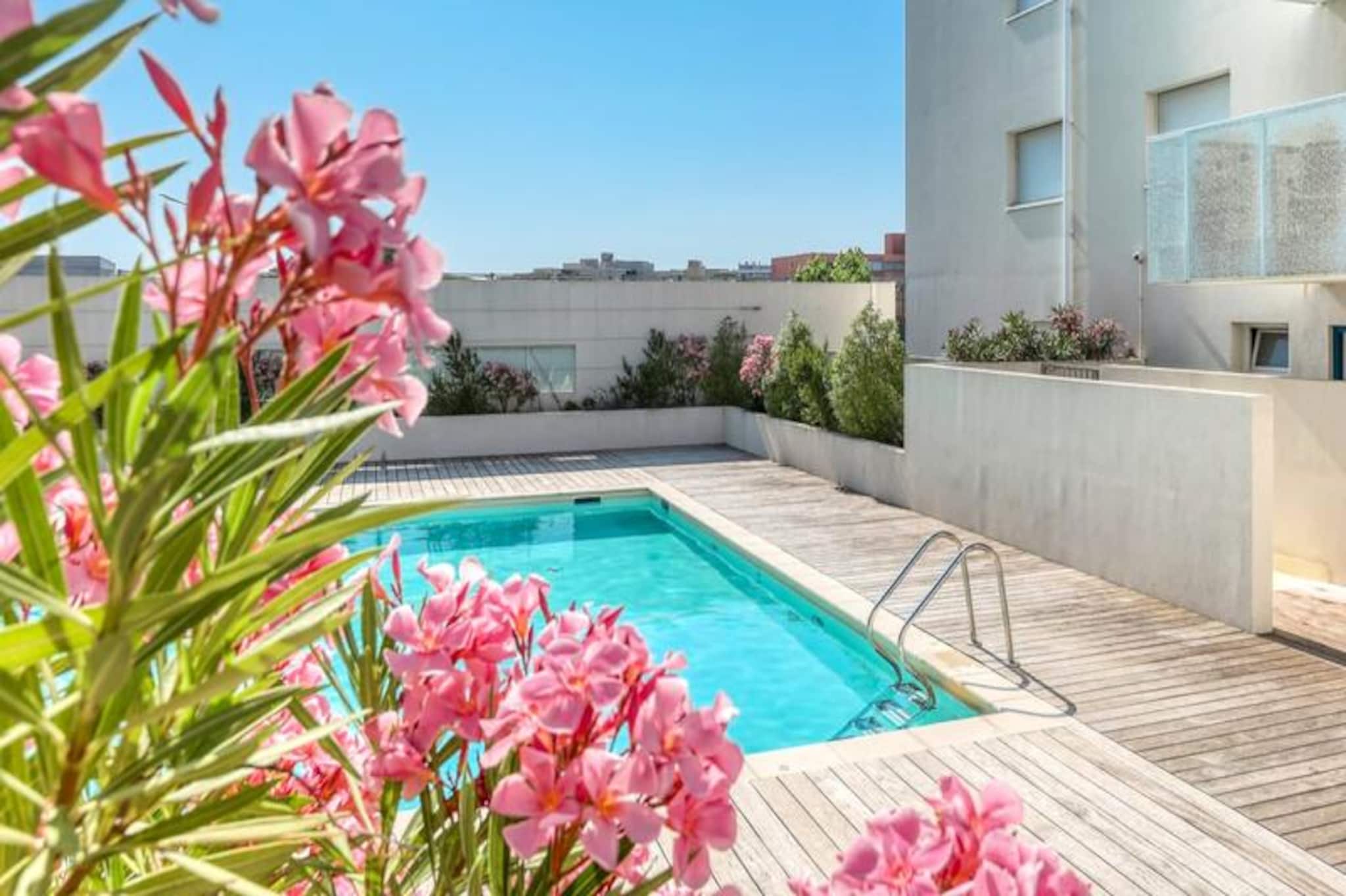 In the heart of the French Riviera, this charming apartment in Le Lavandou invites you to experience the perfect blend of comfort and coastal charm. Surrounded by the vibrant Mediterranean atmosphere, this residence offers a serene retreat just 1 km from the sparkling sea, where golden beaches and azure waters await your arrival. Whether you're planning a family getaway or a relaxing escape with friends, this property promises unforgettable moments under the southern sun. 
 
 The 45m² apartment is thoughtfully designed to accommodate up to six guests, featuring two cozy bedrooms and a comfortable sofa bed in the air-conditioned living room. The open-plan living area leads to a sunny balcony, ideal for enjoying morning coffee or evening aperitifs. A fully equipped kitchen, complete with an oven, dishwasher, microwave, and more, ensures you have everything needed for a stress-free and independent stay. Bed linen and towels are provided, so you can pack light and focus on making memories. 
 
 The secure residence boasts a swimming pool (open May to mid-October), a pétanque court, and a children’s playground just across the street, making it perfect for families. Private parking and secure bicycle storage add to the convenience, while the nearby beach and local shops are easily accessible on foot or by bike. Explore the charming streets of Le Lavandou, indulge in Provençal cuisine, or simply relax by the poolside. 
 
 This modern, well-equipped apartment is your gateway to the best of the Côte d'Azur. With its prime location, thoughtful amenities, and inviting ambiance, it’s the ideal base for a sun-soaked holiday filled with relaxation, exploration, and cherished moments.
