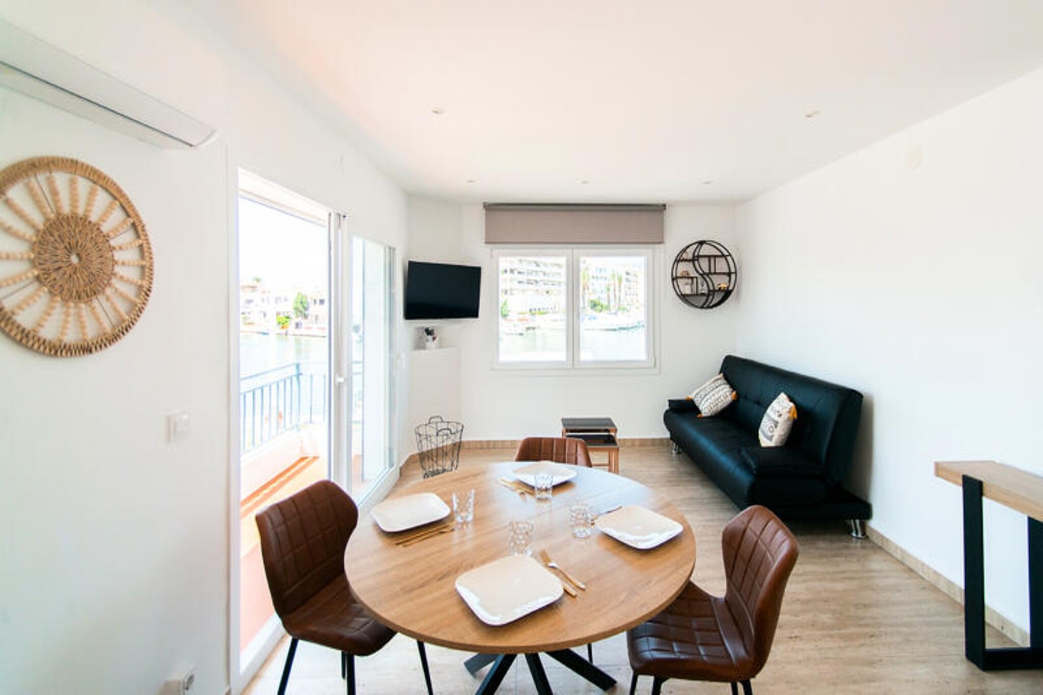 In the enchanting city of Empuriabrava, often referred to as the 'Venice of Spain' for its intricate network of canals, this cozy 45 m² apartment offers an idyllic retreat for up to four guests. Imagine waking up to the gentle sound of water and stepping onto your private terrace to admire the serene views of the canal, a perfect start to your Mediterranean getaway. Every corner of this apartment has been thoughtfully designed to create a warm and inviting atmosphere, blending comfort with charm.
The bright and airy living room is a haven of relaxation, featuring a comfortable sofa bed, a television for cozy evenings, and a dining area perfect for shared meals. The fully equipped kitchen invites you to prepare your favorite dishes, while the terrace provides an unforgettable setting for al fresco dining or simply soaking in the picturesque surroundings. The bedroom, with its plush double bed, promises restful nights, and the modern bathroom with a refreshing shower ensures a rejuvenating start to each day.
Located just a short stroll from the sandy beach, this apartment is a dream for sun-seekers and water enthusiasts. Empuriabrava’s vibrant culinary scene, with its array of cafes, bars, and restaurants, is right at your doorstep, offering the finest Mediterranean flavors. Whether you’re exploring the canals by boat, basking on the beach, or indulging in local delicacies, the area promises endless delights.
This apartment is more than just a place to stay; it’s a gateway to experiencing the charm and beauty of one of Spain’s most picturesque destinations. Perfect for couples or small families, it combines the comforts of home with the allure of a Mediterranean escape.