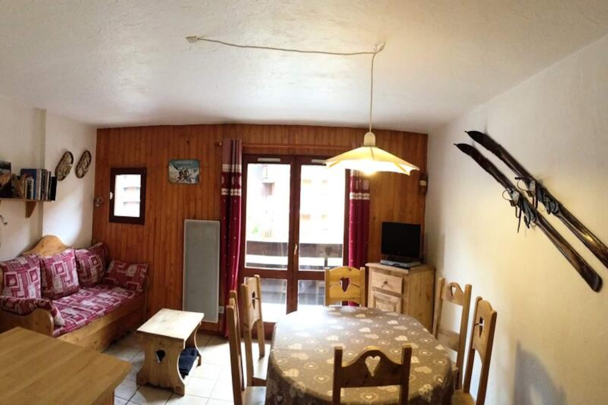 In the heart of the charming village of Valloire, this cozy residence offers a delightful retreat for both winter and summer adventures. Imagine waking up to the crisp alpine air, with the Crêt de la Brive gondola lift just 280 meters away, ready to whisk you to the snowy slopes. In summer, the leisure center with its swimming pool, ice rink, and wellness area is a mere 240 meters from your doorstep, promising fun-filled days for all ages. The vibrant village atmosphere, with shops just 100 meters away, adds to the convenience and charm of this location. \n\nThe apartment is thoughtfully designed to accommodate up to six guests, making it ideal for families or small groups. Two west-facing bedrooms each feature comfortable double beds, while the entrance area provides cozy bunk beds for additional sleeping arrangements. The east-facing living room is a welcoming space, complete with a kitchenette equipped with modern appliances such as an oven, microwave, dishwasher, and ceramic hob. Relax in the lounge area with a television and Wi-Fi, or step onto one of the two balconies to enjoy the serene mountain views. The apartment also includes a bathroom with a shower and washing machine, as well as a separate WC for added convenience. \n\nValloire’s central location ensures easy access to everything you need, from ski schools in winter to the leisure center in summer. The secure communal storage for bicycles and ski equipment adds practicality to your stay, while shared parking provides hassle-free convenience. Whether you’re exploring the slopes or enjoying the summer sunshine, this residence is perfectly positioned for unforgettable alpine experiences. \n\nChoose this charming retreat for its unbeatable location and cozy amenities, and create lasting memories in the picturesque setting of Valloire.