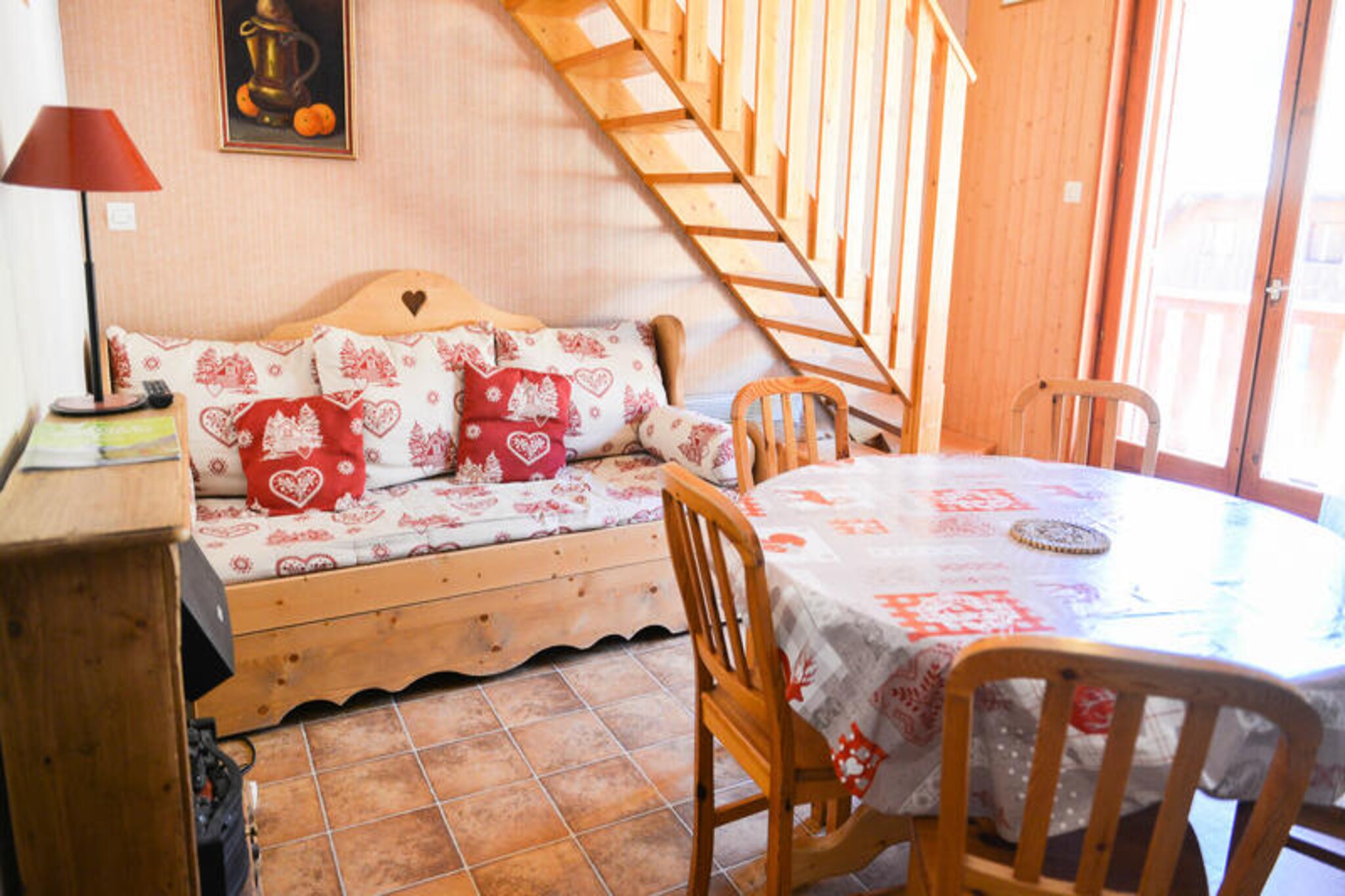 In the serene hamlet of Les Plans, just 550 meters from the heart of Valloire, this charming alpine apartment offers a tranquil retreat surrounded by breathtaking mountain scenery. Whether you're visiting in winter or summer, the property’s location provides easy access to the best of the region, from thrilling ski slopes to vibrant leisure activities. Imagine waking up to crisp alpine air and enjoying the peaceful atmosphere of this quiet neighborhood, with a convenient shuttle stop right at your doorstep for effortless exploration. \n\nDesigned to accommodate up to six guests, the apartment features a thoughtful layout with cozy sleeping arrangements including a bedroom with twin beds, a cabin with a pull-out sofa, and a mezzanine with bunk beds. The well-equipped kitchen invites you to prepare hearty meals after a day of adventure, while the living area with a television offers a welcoming space to unwind. Modern amenities such as a dishwasher, washing machine, and ski locker ensure a comfortable and practical stay. The west-facing balcony is perfect for soaking in the golden hues of the setting sun over the majestic peaks. \n\nIn winter, you’re just 550 meters from the Crêt de la Brive gondola lift, ski school, and village center, making it ideal for snow enthusiasts. During summer, the leisure center with a swimming pool, ice rink, and wellness area is only 400 meters away, while a playground for children is just 150 meters from the residence. The vibrant town of Valloire offers charming shops, local eateries, and cultural events to enhance your stay. \n\nWhether you’re seeking thrilling outdoor adventures or a peaceful alpine escape, this property in Les Plans is your gateway to unforgettable memories in the French Alps.