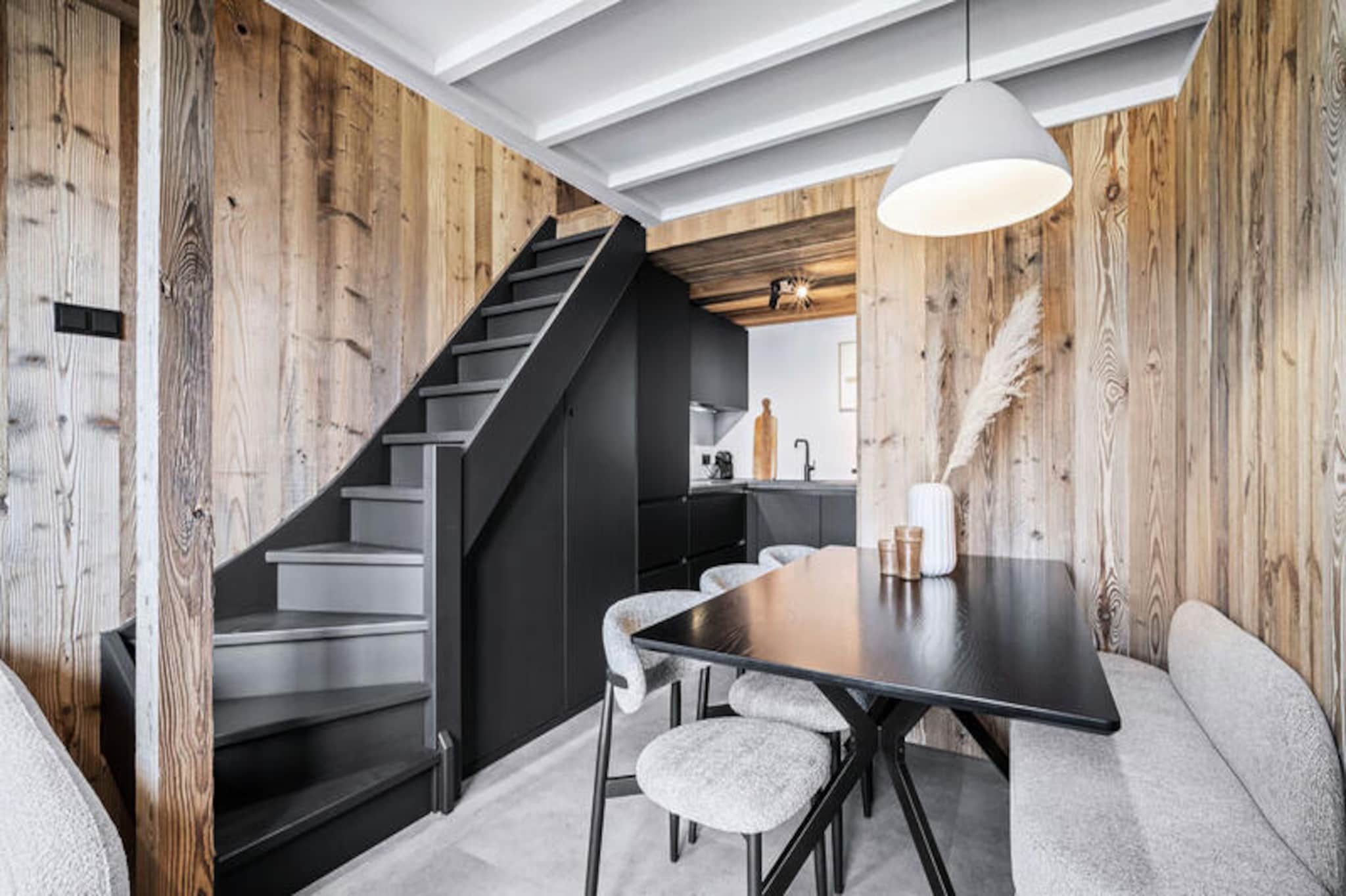 In the heart of the Belleville district in Val Thorens, this charming duplex apartment offers a serene retreat amidst the vibrant energy of the French Alps. Recently renovated, the 33m² space is thoughtfully designed to provide comfort and style for up to four guests. Whether you're seeking a cozy winter escape or a refreshing summer getaway, this property is perfectly situated to make the most of your alpine adventure. From its central yet peaceful location, you'll have easy access to the resort's renowned slopes and lively amenities. \n\nThe apartment spans two levels, offering a smart layout that maximizes space and functionality. On the ground floor, you'll find a welcoming entrance, a cabin with bunk beds, and a tranquil bedroom with a double bed. The lower level features an open-plan living area with a sofa, a fully equipped kitchen, and a balcony where you can soak in the crisp mountain air. A modern bathroom with a shower and a separate toilet complete the conveniences of this home-away-from-home. With included services such as linens, bathroom products, and beds made upon arrival, your stay is designed to be as seamless as it is enjoyable. \n\nVal Thorens, known as the highest ski resort in Europe, offers unparalleled access to the Three Valleys ski area, boasting over 600 kilometers of pistes. Beyond skiing, the resort transforms into a summer haven with hiking trails, mountain biking, and breathtaking alpine vistas. The semi-pedestrian village ensures a tranquil atmosphere, while the nearby shops, restaurants, and après-ski venues provide endless entertainment. \n\nWhether you're drawn by the thrill of the slopes or the allure of alpine tranquility, this duplex apartment is your gateway to an unforgettable Val Thorens experience. Let the majestic peaks and vibrant village life create memories that will last a lifetime.