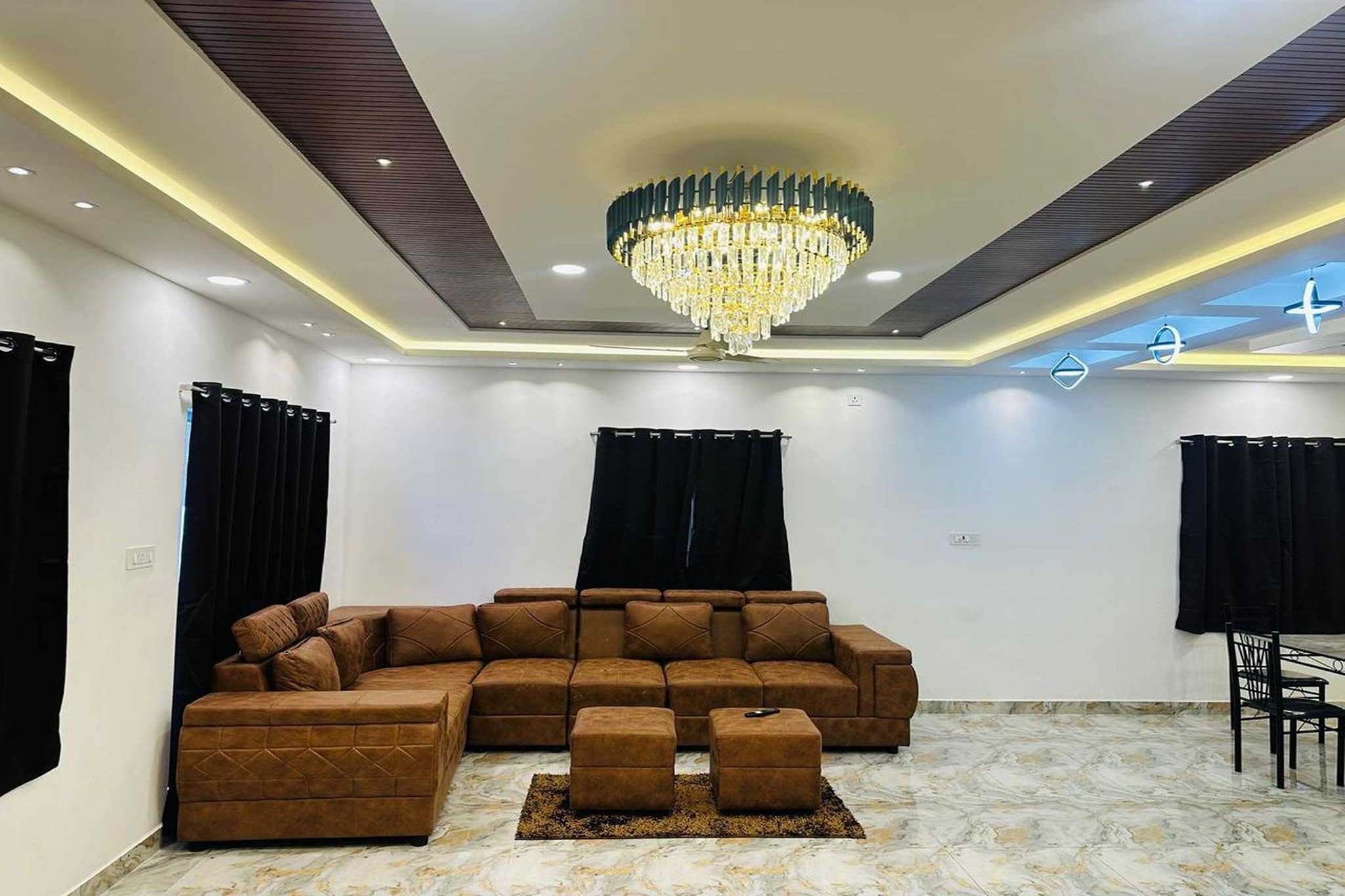 Ground floor: (Living room(single sofa bed, TV, dining table), Kitchen(electric kettle, coffee machine), bedroom(double bed, TV(flatscreen)), bedroom(double bed, TV(flatscreen)), bedroom(double bed, TV(flatscreen)), bedroom(double bed, TV(flatscreen)), bedroom(double bed, TV(flatscreen)), bathroom(shower, washbasin, toilet, shampoo, body soap), bathroom(shower, washbasin, toilet, shampoo, body soap), bathroom(shower, washbasin, toilet), bathroom(shower, washbasin, toilet), bathroom(shower, washbasin, toilet), electric kettle, swimming pool(private), iron)