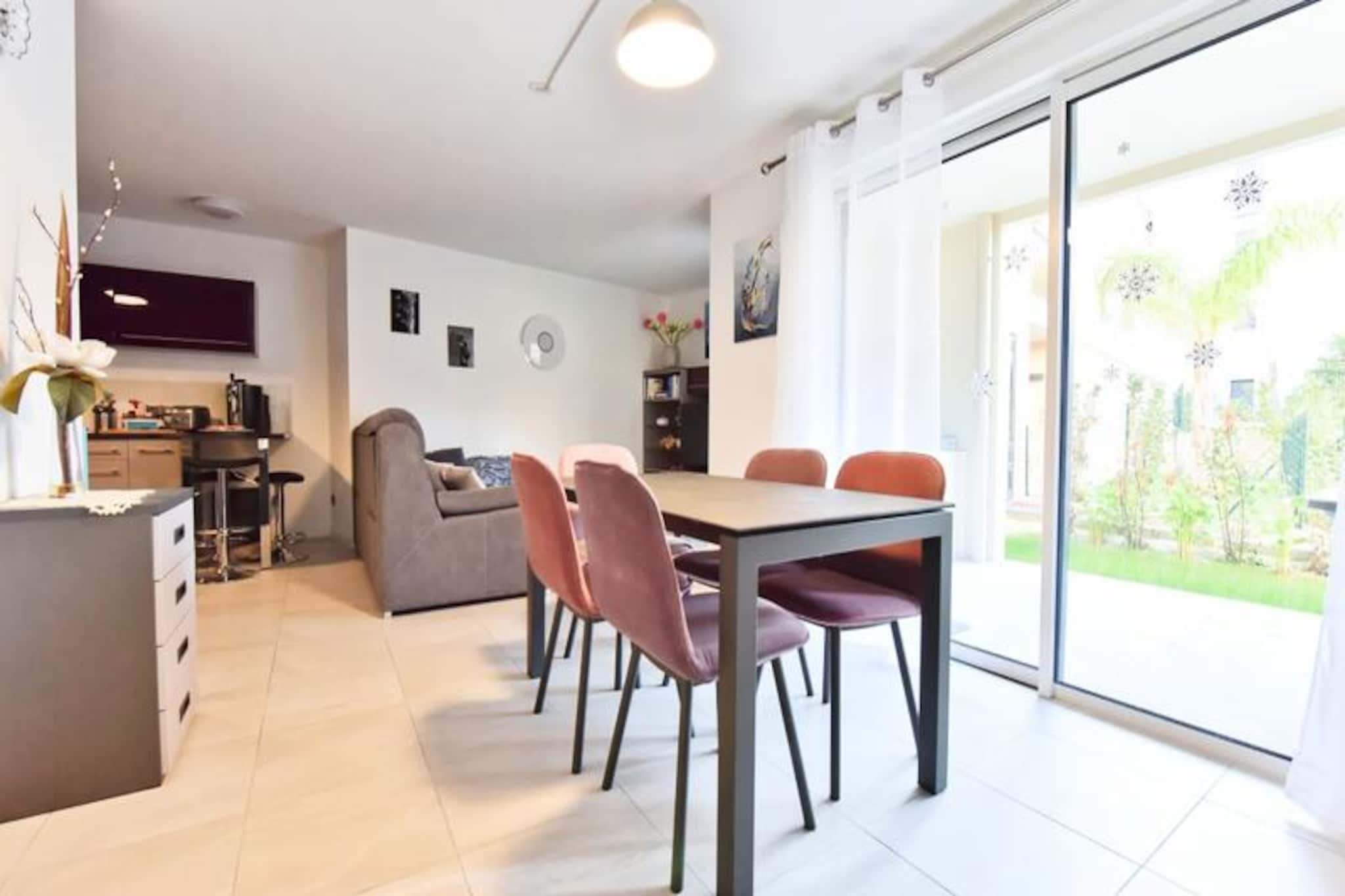 Step into a world of effortless elegance and coastal charm at this delightful two-bedroom apartment in the heart of Palm Beach, Cannes. Imagine starting your day with breakfast on the terrace overlooking the sparkling pool, surrounded by lush greenery and the soothing Mediterranean breeze. This ground-level retreat offers 75 square meters of thoughtfully designed space, perfect for unwinding and embracing the relaxed rhythm of the French Riviera. Whether you're here for leisure or business, the apartment's serene ambiance and prime location make it an ideal choice. \n\nInside, you'll find a cozy yet stylish living area that seamlessly blends comfort and functionality. The open-plan kitchen is fully equipped, including a dishwasher, making meal preparation a breeze. The dining area, with seating for six, invites you to share memorable moments over delicious meals. The living room, complete with a flat-screen TV, opens onto a furnished terrace featuring an electric barbecue and griddle—perfect for al fresco evenings. The master suite, designed for guests with reduced mobility, boasts a king-size bed, a spacious wardrobe, a desk area, and a private shower room. The second bedroom offers a queen-size bed and ample storage, while a second shower room ensures convenience for all guests. \n\nStep outside, and you'll find yourself just minutes away from Mouré Rouge beach, where you can soak up the sun or enjoy a cocktail by the sea. Palm Beach’s charming village atmosphere offers everything from local shops to bakeries and pharmacies. A leisurely stroll along the iconic Croisette or a peaceful moment in Jardin des Hespérides is just around the corner. For those looking to explore further, the Palais des Congrès and Cannes city center are a short drive away, as is the train station connecting you to the wonders of the French Riviera. \n\nWith private underground parking, high-speed Wi-Fi, and a secure building, this apartment ensures a hassle-free stay. Whether you're here for the vibrant local culture, stunning beaches, or simply to relax by the pool, this Palm Beach gem offers an unforgettable escape in the heart of Cannes.