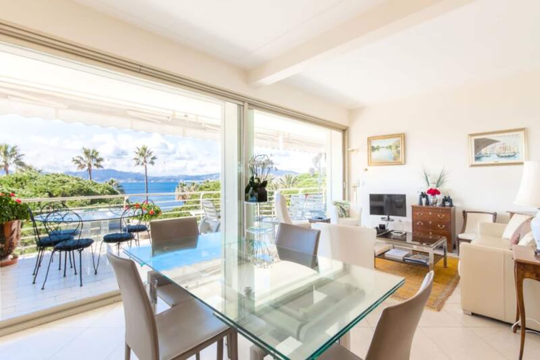 As the sun dips below the horizon, casting golden hues across the Mediterranean, this exquisite 3-room apartment in Cannes' prestigious Palm Beach district offers a serene retreat at the tip of the iconic Croisette. With a breathtaking 180-degree sea view from its expansive west-facing terrace, this property invites you to unwind in style while savoring the beauty of the Côte d'Azur. Whether you're here for leisure or luxury, the tranquility of this high-floor haven is unmatched. \n\nInside, the apartment is thoughtfully designed for comfort and elegance. The spacious living room, complete with a sofa bed, armchairs, flat-screen TV, and dining table, opens directly onto the terrace, creating a seamless indoor-outdoor experience. A fully equipped separate kitchen caters to all your culinary needs, while the two bedrooms offer restful sanctuaries. The master bedroom boasts a queen-size bed, an en-suite shower room, and terrace access, while the second bedroom features two single beds. Two modern bathrooms ensure convenience for all guests. Reversible air conditioning and WiFi are included, ensuring a comfortable stay year-round. \n\nStep outside and immerse yourself in the allure of Cannes. From the Palais des Festivals et des Congrès, where the world’s most glamorous events unfold, to the luxury boutiques of Chanel and Dior, everything is within walking distance. Stroll along the Croisette, relax on pristine beaches, or explore the historic charm of Le Suquet. For nature lovers, the Lérins Islands are just a short ferry ride away, offering lush landscapes and crystal-clear waters. \n\nWhether you’re here for the vibrant nightlife, indulgent shopping, or peaceful sunsets, this apartment is the perfect base to experience the magic of Cannes. Let the Mediterranean breeze and the glamour of the French Riviera create unforgettable memories during your stay.