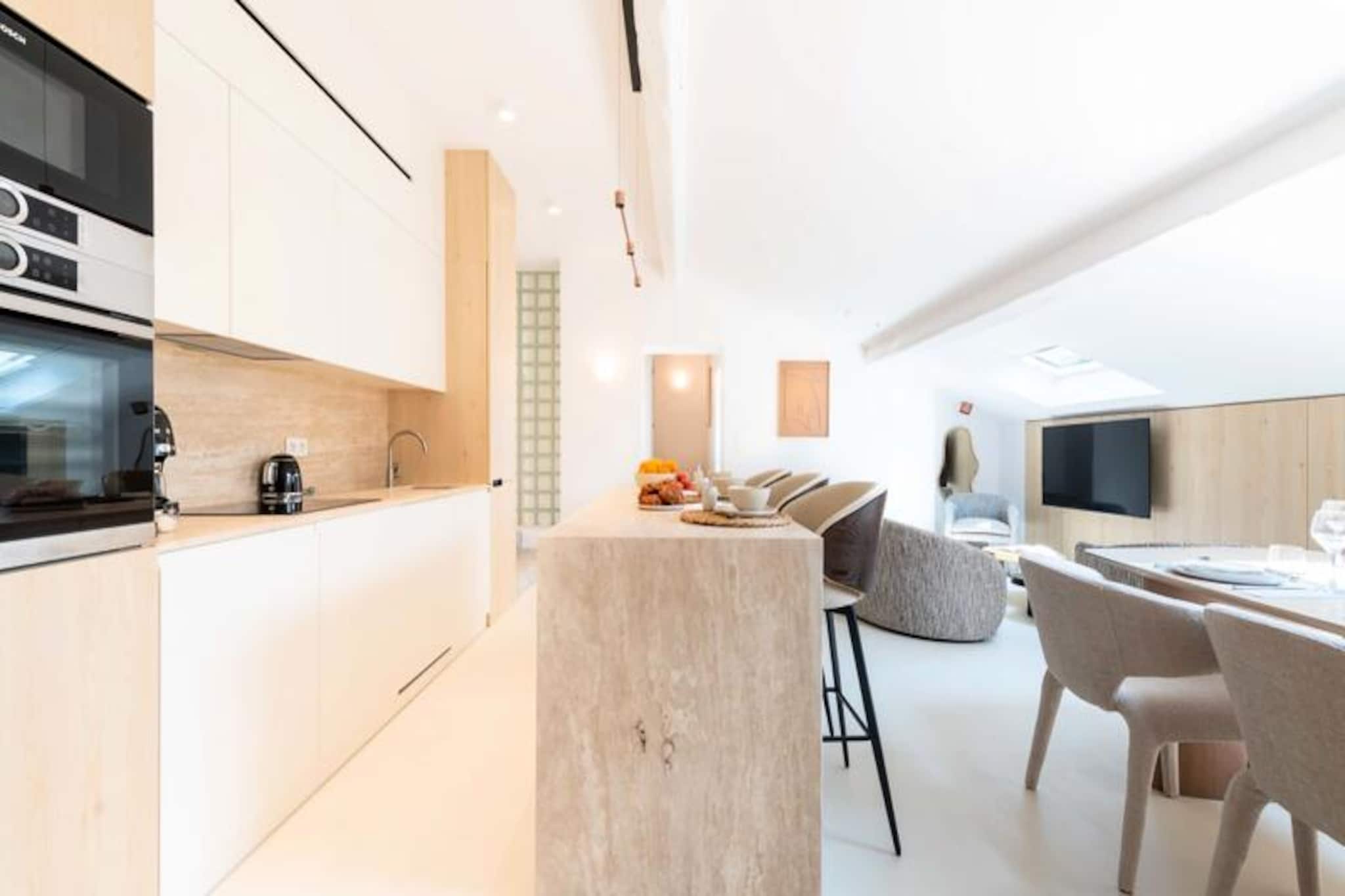 High above the bustling streets of Cannes, this elegant duplex offers a sanctuary of contemporary charm and tranquility. Bathed in natural light and thoughtfully designed, it provides a perfect retreat just steps away from the city’s vibrant pulse. Whether you’re here for the iconic beaches, luxury shopping, or world-renowned festivals, this central location ensures you’re always at the heart of the action. Imagine mornings filled with fresh pastries from nearby bakeries, afternoons exploring Rue d’Antibes, and evenings strolling along La Croisette as the sun sets over the Mediterranean. \n\nThe apartment is situated on the top floor of a typical Cannes building, accessible via elevator, and boasts high-end furnishings and modern amenities. The main level features a spacious living area under the eaves, complete with a cozy TV corner, dining space, and a fully equipped open-plan kitchen. Two serene bedrooms with queen-size beds, a stylish shower room, and a separate toilet complete this floor. Upstairs, the third bedroom offers a charming retreat with a sloping ceiling, double bed, private shower room, and separate toilet. Reversible air conditioning and Wi-Fi ensure comfort and convenience throughout your stay. \n\nStep outside and immerse yourself in the best of Cannes. Rue d’Antibes, with its boutiques and cafes, is just a minute’s walk away, while the iconic La Croisette and its beaches are a mere four minutes on foot. The Palais des Festivals, perfect for conference attendees or festival-goers, is six minutes away, and the lively Forville Market is within a ten-minute stroll. For a touch of nature, the Lérins Islands are easily accessible via a short boat ride from the nearby quay. \n\nWhether you’re here for business or leisure, this duplex combines style, comfort, and an unbeatable location to create unforgettable memories in the heart of Cannes.