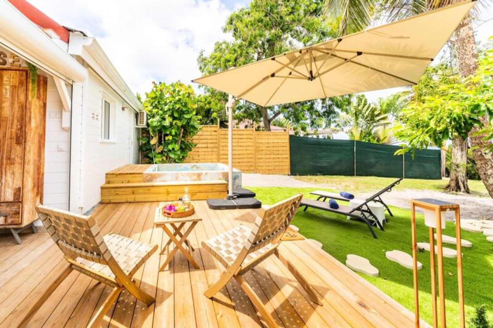 On the idyllic island of Marie-Galante, where the turquoise sea meets lush landscapes, Moca Cabana offers an intimate retreat for couples seeking tranquility and romance. This charming bungalow is a haven of serenity, inviting you to disconnect from the everyday and immerse yourself in the natural beauty of the Caribbean. Wake up to the gentle sea breeze and breathtaking views of the horizon, setting the tone for a day of relaxation and discovery. \n\nDesigned with comfort and elegance in mind, Moca Cabana features an air-conditioned bedroom that opens to stunning ocean vistas, ensuring a peaceful and refreshing stay. The modern bathroom, complete with a walk-in shower, adds a touch of luxury, while the fully equipped kitchen allows you to prepare meals at your leisure. Step out onto the shaded terrace to enjoy al fresco dining or unwind in the hammock as the trade winds lull you into a state of bliss. The private pool is perfect for cooling off under the Caribbean sun, making every moment at Moca Cabana truly unforgettable.\n\nLocated in Grand-Bourg, the bungalow is just minutes from the island’s most beautiful beaches, including La Feuillère and Anse Canot, where pristine sands and crystal-clear waters await. Explore the local markets, savor Creole cuisine at nearby restaurants, or venture into the sugarcane fields and hiking trails that define Marie-Galante’s unique charm. For those seeking adventure, the concierge team can arrange excursions, car rentals, and more to enhance your stay.\n\nWhether you’re celebrating a special occasion or simply escaping the routine, Moca Cabana offers the perfect blend of comfort, privacy, and authentic island living. Let the magic of Marie-Galante captivate you as you create memories to cherish for a lifetime.