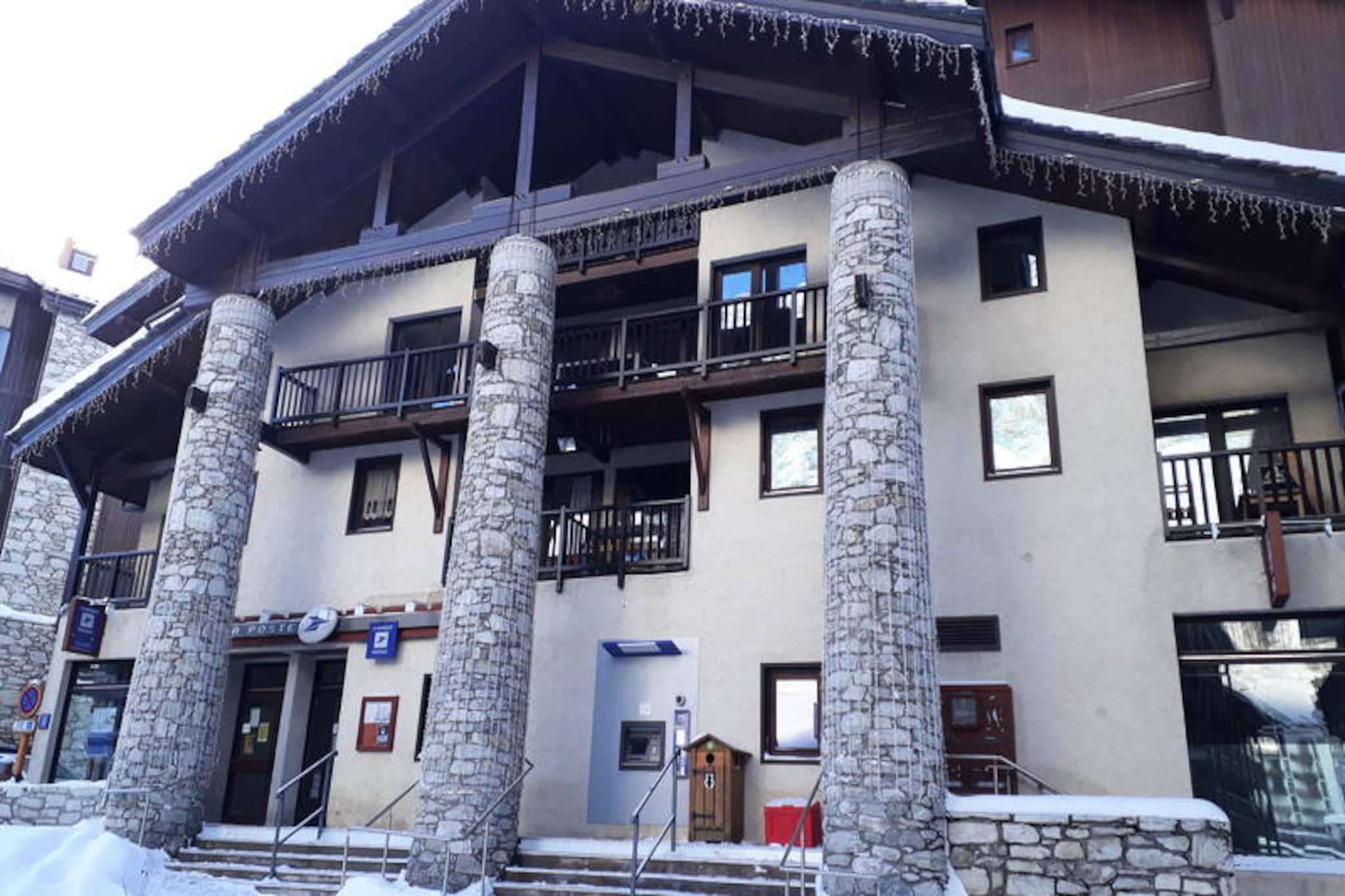 Amid the charming streets of Val d'Isère's historic village, this cozy apartment offers an unparalleled ski-in/ski-out experience right in the heart of the action. Imagine stepping out onto your private balcony, breathing in the crisp alpine air, and soaking up the vibrant atmosphere of one of France's most iconic ski destinations. Whether you're here for thrilling days on the slopes or tranquil evenings in a picturesque mountain setting, this apartment is your gateway to it all. \n\nThoughtfully renovated and designed for comfort, the 23 m² apartment is ideal for two guests seeking a warm and welcoming retreat. Located on the first floor of the Village C residence, it features a living room with a dining area, a well-equipped kitchen with modern appliances, and a bedroom with two cozy single beds. The shower room and separate WC add convenience, while amenities like Wi-Fi and television ensure you stay connected and entertained during your stay. With linens, towels, and beds made upon arrival, you can simply relax and enjoy your holiday from the moment you arrive. \n\nThe central location places you steps away from shops, restaurants, and the ski lifts, making it effortless to explore the world-class slopes of Val d'Isère and Tignes. In winter, take advantage of preferential rates on ski passes for the legendary Espace Killy domain. During summer, the area transforms into a haven for hikers, cyclists, and nature enthusiasts, with breathtaking trails and alpine vistas. \n\nWhether you're chasing powder or seeking serenity, this apartment offers the perfect blend of convenience, charm, and alpine allure. Make your stay in Val d'Isère unforgettable with this delightful mountain retreat.