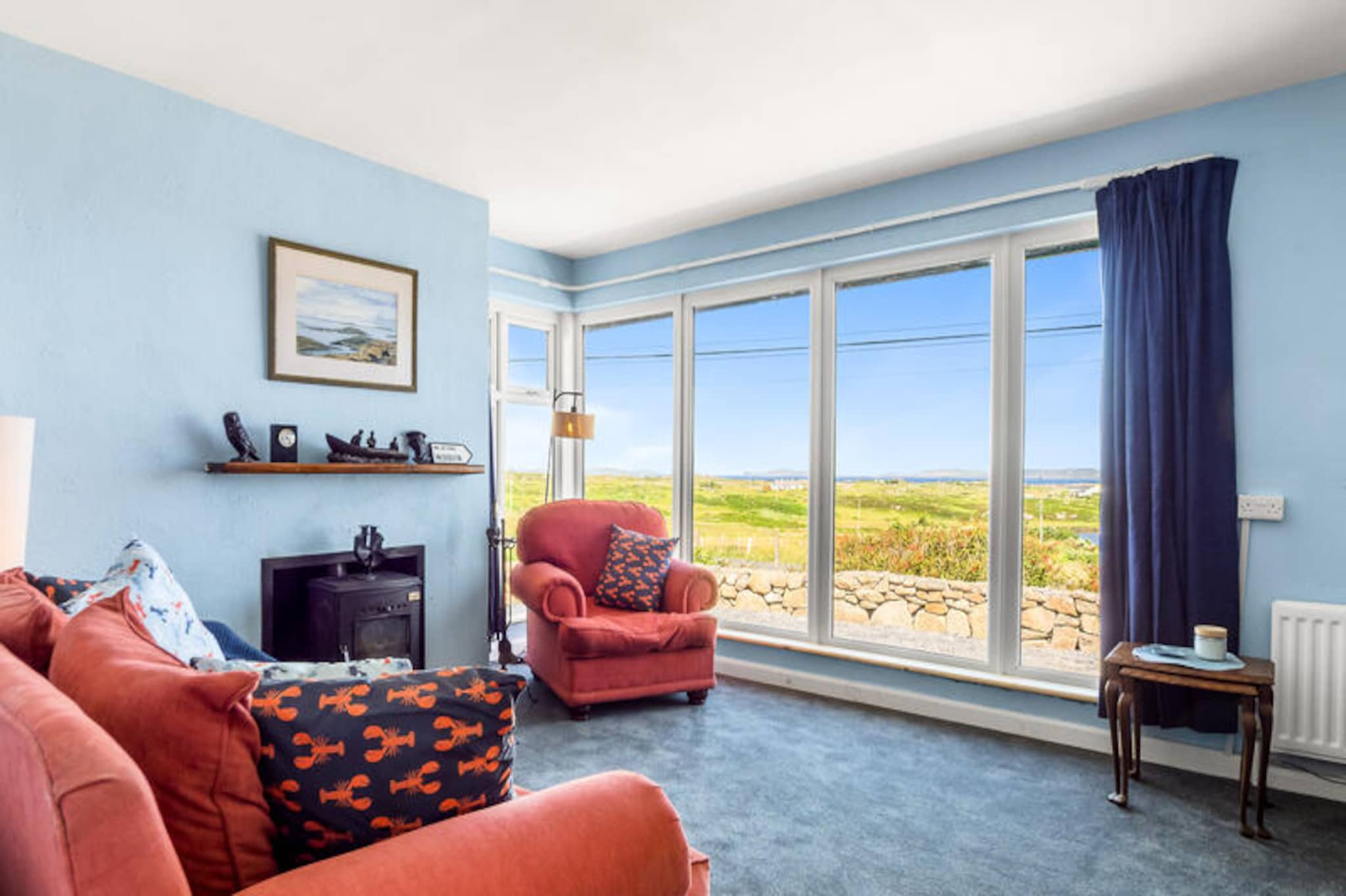 On the rugged coastline of Ireland's Wild Atlantic Way, this charming home in Cleggan offers a tranquil retreat with breathtaking views of the sea and nearby lake. Surrounded by unspoiled nature and just a short drive from picturesque beaches, this property is a haven for those seeking peace, adventure, and the timeless beauty of Connemara. Whether you're sipping morning coffee in the garden or watching the sun set over the water, every moment here feels like a step into serenity.  
                      With four spacious bedrooms, this 117 m² home comfortably accommodates up to seven guests, making it ideal for families or groups of friends. The property is thoughtfully equipped with modern amenities, including Wi-Fi, central heating, and two TVs, ensuring a comfortable stay no matter the season. The electric kitchen is fully fitted with everything you need to prepare delicious meals, from a dishwasher to a juicer. After a day of exploring, unwind by the cozy fireplace or enjoy a movie night with the DVD player. The garden, complete with outdoor furniture, invites you to relax and soak in the surrounding beauty.  
                      Just 2 km away, you'll find the charming village of Claddaghduff, with its local shop, beachside bar, and sandy shores. The vibrant village of Cleggan is only 3 km away, offering fresh seafood at Oliver’s Seafood Bar & Restaurant and delightful treats at Little Fish Cafe. For outdoor enthusiasts, the nearby beaches of Anchor, Rossadillisk, and Omey Island provide endless opportunities for exploration. Connemara National Park, a mere 18 km away, offers stunning hiking trails and panoramic views of the region.  
                      Whether you're here to discover the rugged beauty of Connemara, enjoy fresh seafood, or simply relax by the fire, this Cleggan home is the perfect base for your Irish adventure.