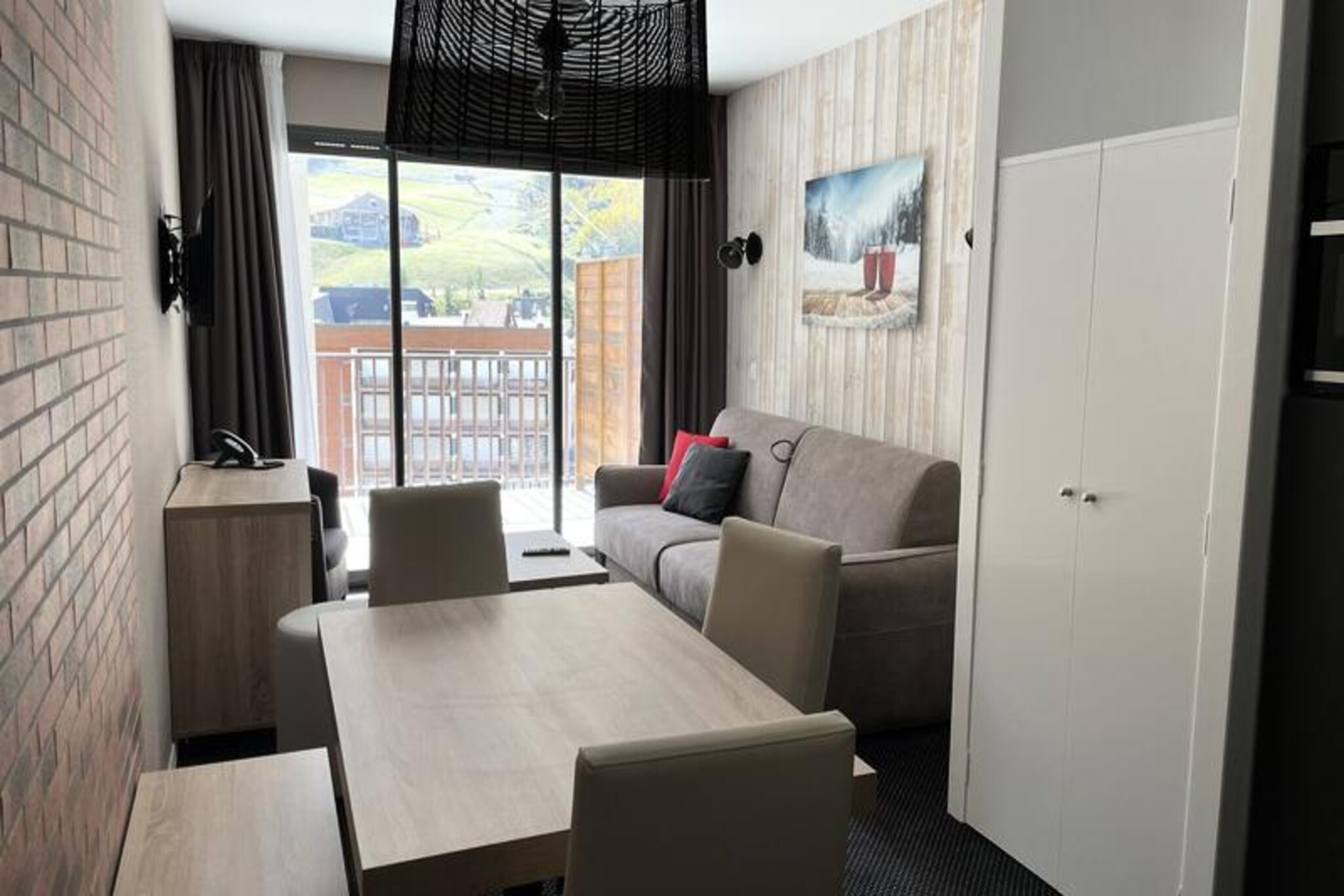 In the picturesque village of Gourette, surrounded by the majestic Pyrenees, this charming studio apartment offers a perfect retreat for nature lovers and adventure seekers alike. Located at 16 Route du Col d'Aubisque, the residence places you just 150 meters from the ski slopes and 100 meters from local shops, ensuring convenience and accessibility throughout your stay. Whether you’re here to carve through fresh powder in winter or explore scenic hiking trails in summer, this destination promises unforgettable experiences year-round. \n\nThe studio, situated on the third floor of the Le Portillo Residence, is thoughtfully designed for up to four guests. Its southwest-facing terrace provides stunning views of the slopes and surrounding mountains, making it an ideal spot to unwind after an active day. Inside, you’ll find a cozy living room with a double sofa bed, a sleeping alcove with bunk beds, and a fully equipped open-plan kitchen featuring modern appliances like a ceramic hob, oven, microwave, and dishwasher. The bathroom includes a shower, sink, and hairdryer, ensuring all the comforts of home. Linens are provided, and the property is smoke-free, with pets welcome for an additional fee.\n\nThe residence boasts exceptional amenities, including a heated indoor swimming pool, jacuzzi, children’s pool, gym, and games room. Ski enthusiasts will appreciate the ski room with individual boot dryers, while cyclists can take advantage of the secure bike storage. Additional services such as ski equipment rental, covered parking, and meal packages are available upon request. Guests also benefit from exclusive discounts on ski equipment and lift passes through the SKIPLUS program. \n\nWhether you’re seeking thrilling outdoor adventures or a tranquil mountain escape, this studio apartment in Gourette offers the perfect blend of comfort, convenience, and breathtaking natural beauty. Create lasting memories in the heart of the Pyrenees, where every season brings its own unique charm.