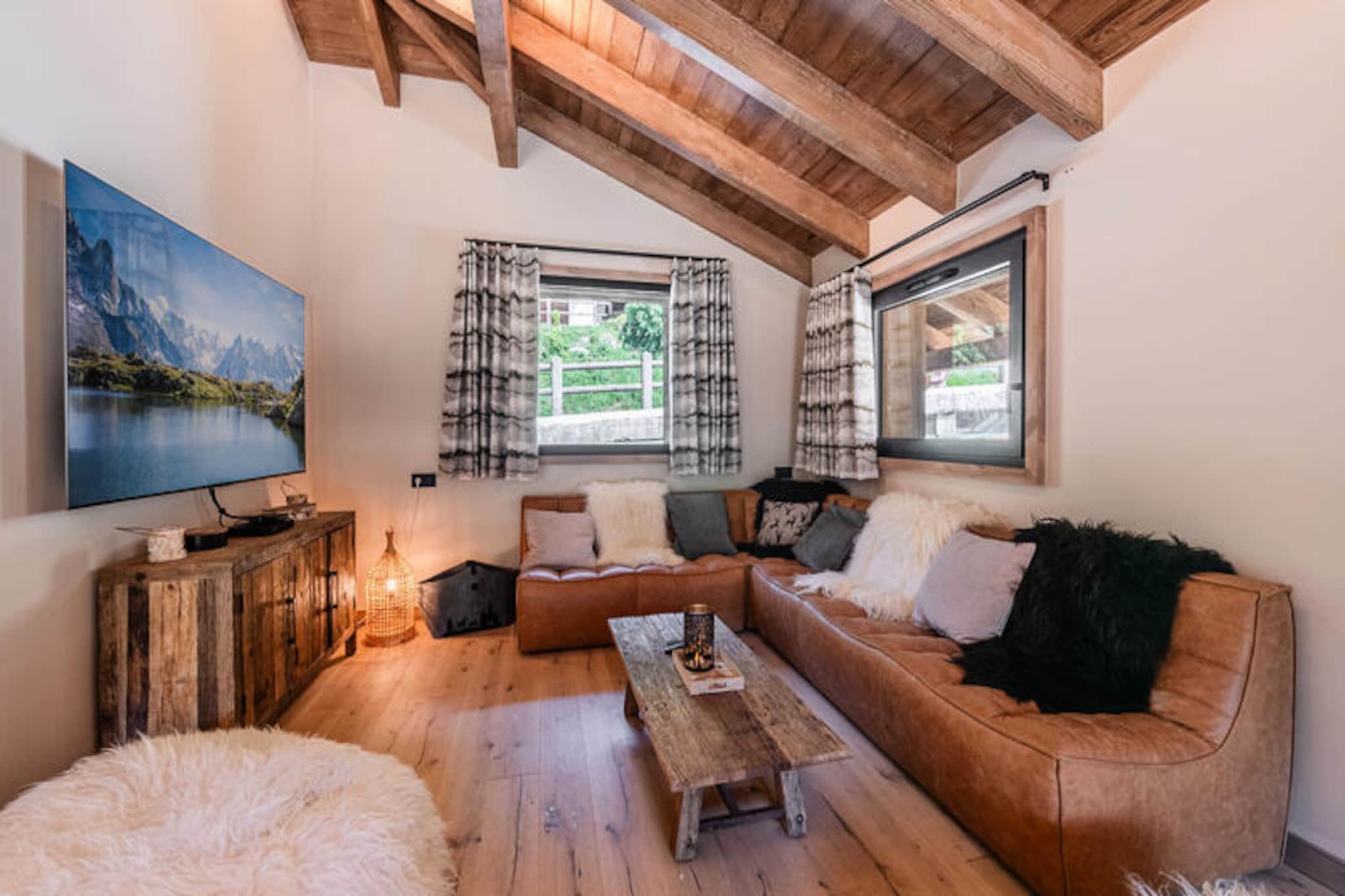 In the picturesque Nyon district of Morzine, Chalet Bonheur invites you to experience the perfect blend of modern comfort and alpine charm. Just 1.5 km from the lively center of Morzine and a short distance from the Nyon cable car, this brand-new two-story chalet is an ideal retreat for families or groups seeking a serene mountain escape. With a nearby shuttle bus stop, exploring the area has never been easier. \n\nSpanning 140 m², this spacious chalet accommodates up to 10 guests with its thoughtfully designed layout. On the ground floor, you’ll find a cozy living area complete with a wood-burning stove, a dining room perfect for shared meals, and a fully equipped open-plan kitchen featuring modern appliances such as an induction hob, dishwasher, and coffee maker. Step out onto the balcony or terrace to soak in the crisp mountain air and stunning views. The basement offers four comfortable bedrooms, including a master suite with a double bed and en suite bathroom, a room with two single beds, and a family-friendly bunk room that sleeps four. Additional amenities include a ski locker, Wi-Fi, and outdoor parking spaces.\n\nThe chalet’s location provides easy access to the Nyon cable car, opening up a world of skiing and hiking opportunities. The vibrant center of Morzine offers a variety of shops, restaurants, and après-ski activities, while the surrounding mountains promise breathtaking trails and adventure. Whether you’re visiting in winter for the slopes or in summer for the lush alpine scenery, Chalet Bonheur is your gateway to unforgettable moments.\n\nWith its warm ambiance, modern amenities, and prime location, Chalet Bonheur ensures a seamless and memorable stay. From the moment you arrive to the final farewell, every detail is taken care of, including bed linens, towels, and end-of-stay cleaning. Discover the magic of Morzine and create cherished memories in this exceptional mountain retreat.