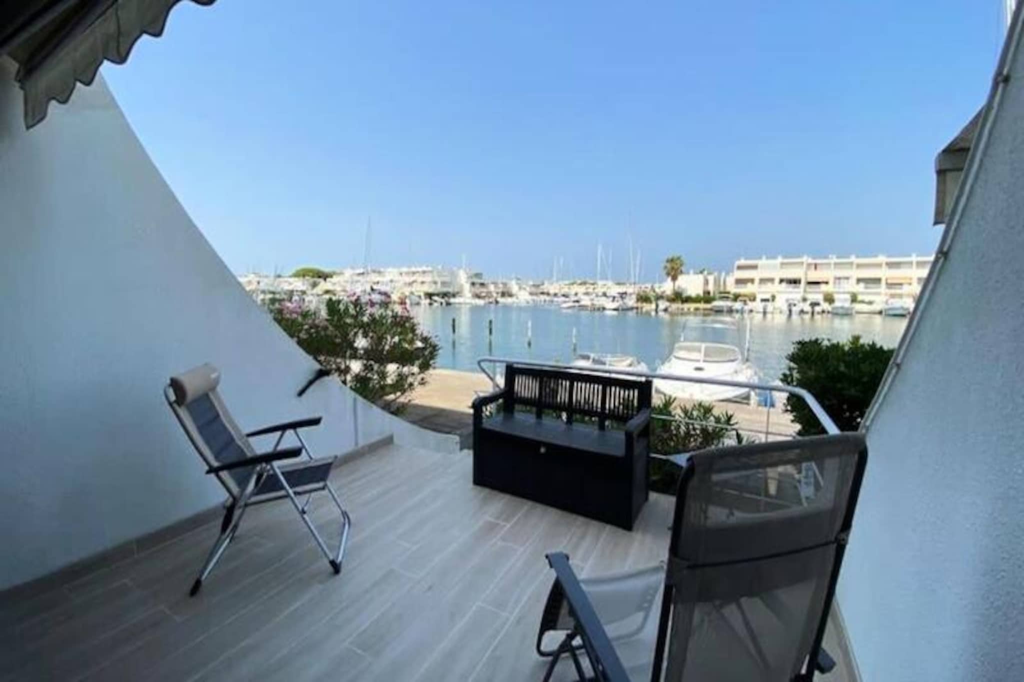 In the heart of the picturesque Port Camargue, this stunning marina residence offers a serene escape by the water. Imagine waking up to the gentle sounds of the marina, with sunlight streaming onto your private terrace, perfect for savoring a morning coffee or an evening aperitif. The tranquil atmosphere of this unique location invites you to unwind and embrace the beauty of southern France. Whether you're seeking a peaceful retreat or an active holiday, this marina is your gateway to both relaxation and adventure.
Spanning 70m², the property is thoughtfully designed to accommodate up to six guests. The ground floor features a spacious living room that opens onto a sunlit terrace, seamlessly blending indoor and outdoor living. The fully equipped kitchen ensures you have everything you need to prepare delicious meals. Upstairs, two beautifully appointed bedrooms await: one with a motorized 160cm bed for ultimate comfort, and another with two 80x200cm mattresses. A third sleeping area with a bunk bed (single and double) makes this marina ideal for families or groups of friends. The modern shower room adds a touch of luxury to your stay.
Port Camargue is a haven for water enthusiasts and nature lovers alike. Explore the vibrant marina, enjoy fresh seafood at nearby restaurants, or rent bicycles to discover the scenic trails of the Camargue region. The sandy beaches are just a short stroll away, offering endless opportunities for sunbathing, swimming, or simply soaking in the Mediterranean charm. For those seeking cultural experiences, the historic towns of Aigues-Mortes and Montpellier are within easy reach.
Whether you're here to relax by the water, explore the rich heritage of the region, or indulge in coastal adventures, this marina residence promises an unforgettable stay. Let the gentle rhythm of the marina set the tone for your perfect getaway.