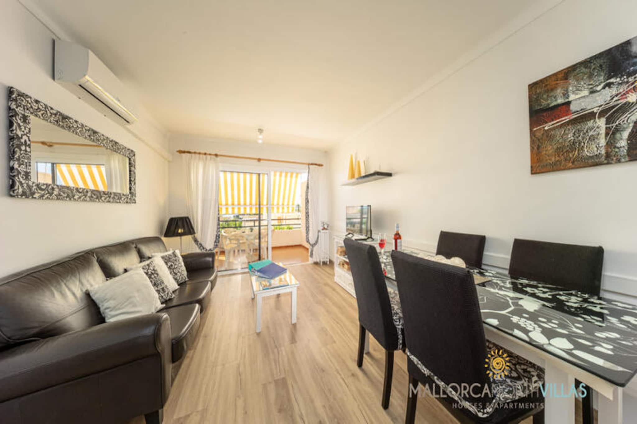 Bask in the Mediterranean charm of Puerto de Alcúdia with this bright and inviting 3-bedroom apartment, just a 6-minute stroll from the golden sands of Alcúdia Beach. Perfectly suited for families or groups of up to five, this retreat offers a harmonious blend of comfort, convenience, and coastal allure. Wake up to the gentle sea breeze, step out onto your private balcony, and plan a day filled with sun-soaked adventures or tranquil relaxation. \n\nInside, the apartment spans 90 square meters of thoughtfully designed living space. The three bedrooms include a cozy double room, a twin room, and a single room, ensuring restful nights for everyone. The living and dining area is bathed in natural light, creating a welcoming space to unwind after a day of exploration. The fully equipped kitchen, complete with a coffee maker, microwave, and toaster, invites you to prepare delicious meals with ease. Modern amenities like air conditioning, heating, and a safe ensure a comfortable stay year-round.\n\nThe location is unbeatable. A short walk brings you to the pristine beach, while the historic charm of Alcúdia's old town is just 3 kilometers away. Nearby, you'll find an array of restaurants, bars, and supermarkets, as well as natural wonders like Lake Esperanza and the Albufera Natural Park. Whether you're into hiking, water sports, cycling, or simply soaking up the sun, this apartment places you at the heart of it all.\n\nWith its prime location and welcoming ambiance, this apartment is your gateway to an unforgettable Mallorcan getaway. Create cherished memories as you explore the vibrant surroundings, indulge in local cuisine, and relax by the sparkling Mediterranean waters.