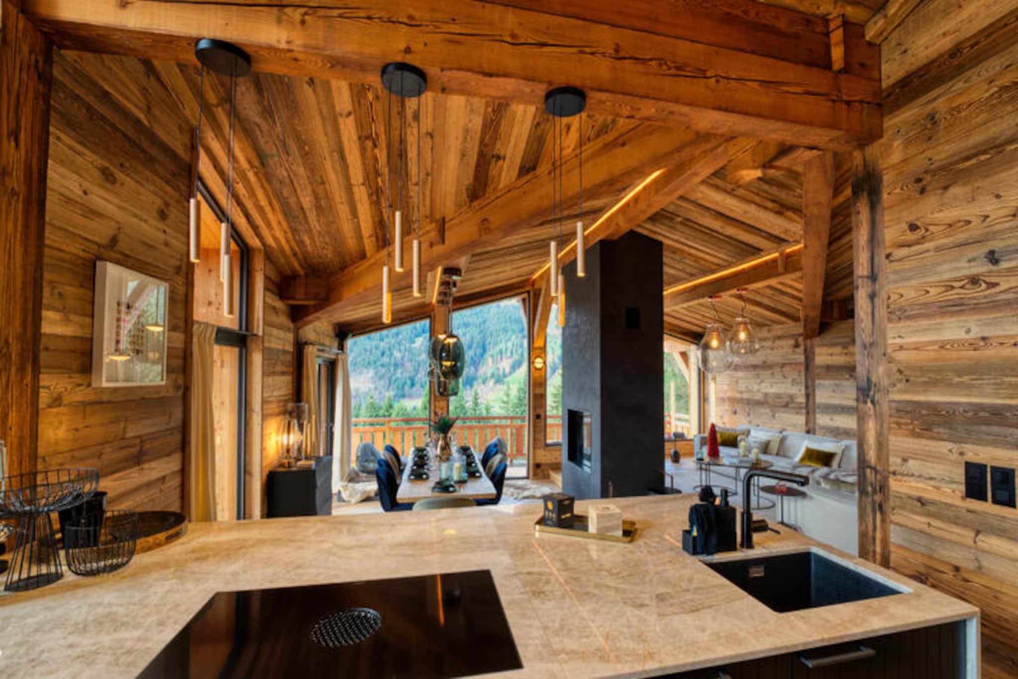 Imagine waking up to the crisp mountain air and the serene beauty of the Alps at Chalet Cheval Blanc, a luxurious retreat perched on the Chavannes slope in the prestigious Gibannaz area of Les Gets. This high-end chalet offers an enchanting alpine escape with panoramic views of the charming village below and the majestic Marcelly peak in the distance. Whether you're visiting for the thrill of skiing or the tranquility of the mountains, this chalet promises an unforgettable experience.
Spanning 200 m² across two levels, Chalet Cheval Blanc is designed to accommodate up to 10 guests in absolute comfort. Its four elegant bedrooms, each paired with a private bathroom, ensure privacy and relaxation for all. The open-plan kitchen is fully equipped for culinary adventures, while the spacious living area, complete with a large dining table for 10 and a central fireplace, invites cozy evenings by the fire. High-quality materials and thoughtful design create a warm yet sophisticated ambiance throughout the property.
Step outside and immerse yourself in the chalet's outdoor luxuries. The sunny terrace, adorned with bespoke garden furniture, an outdoor fireplace, and a sound system, is perfect for unwinding after a day on the slopes. Indulge in the outdoor jacuzzi as you soak in the breathtaking alpine views. For ski enthusiasts, the chalet's proximity to the slopes—just a few dozen meters away—ensures effortless access to the powdery trails, while the ski room with boot warmers adds an extra touch of convenience.
Chalet Cheval Blanc is more than just a place to stay; it’s a destination in itself. Whether you're seeking adventure, relaxation, or a mix of both, this exceptional property offers the perfect balance of luxury and nature. Create cherished memories in the heart of Les Gets, where every moment feels like a postcard come to life.
