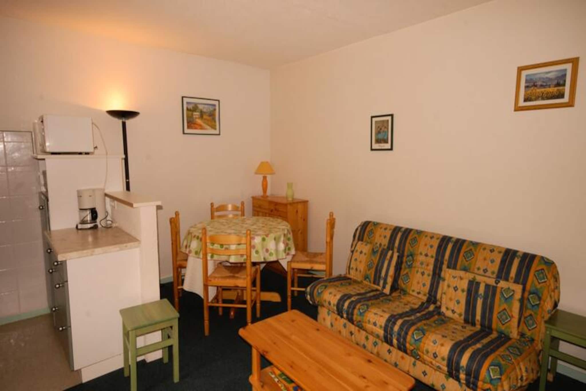 Positioned in the scenic Pyrenean village of Les Angles, Residence Les Isards offers a cozy retreat just 150 meters from the slopes, making it a perfect choice for ski enthusiasts and nature lovers alike. Imagine waking up to the breathtaking views of snow-covered peaks from your southwest-facing studio apartment, with the crisp mountain air invigorating your senses before a day of alpine adventure. Whether you're here for winter sports or summer hikes, this charming residence is your gateway to the beauty of the Pyrenees. \n\nThe studio apartment comfortably accommodates up to six guests, featuring a sleeping alcove with two sets of bunk beds and a living room with a double sofa bed. The kitchen is fully equipped with a ceramic hob, oven, microwave, refrigerator, dishwasher, and essential appliances like a coffee maker and toaster, ensuring you can prepare delicious meals with ease. The bathroom includes a bathtub and sink, with a separate toilet for added convenience. Electric heating keeps the space warm and inviting, while the provided bed linen adds a touch of comfort. Non-smoking and pet-friendly, the apartment caters to diverse needs, offering optional extras like meal plans, cleaning services, and laundry facilities at reception. \n\nLocated just 100 meters from local shops and dining options, Residence Les Isards ensures everything you need is within easy reach. Guests benefit from exclusive discounts on ski equipment rentals and lift passes through the SKIPLUS offer, making your winter getaway even more enjoyable. In summer, explore the lush trails and serene landscapes that surround this picturesque village, or simply relax and soak in the tranquility of the Pyrenees. \n\nWhether you're seeking thrilling slopes, peaceful mountain escapes, or a blend of both, Residence Les Isards promises an unforgettable stay in the heart of the French Pyrenees.