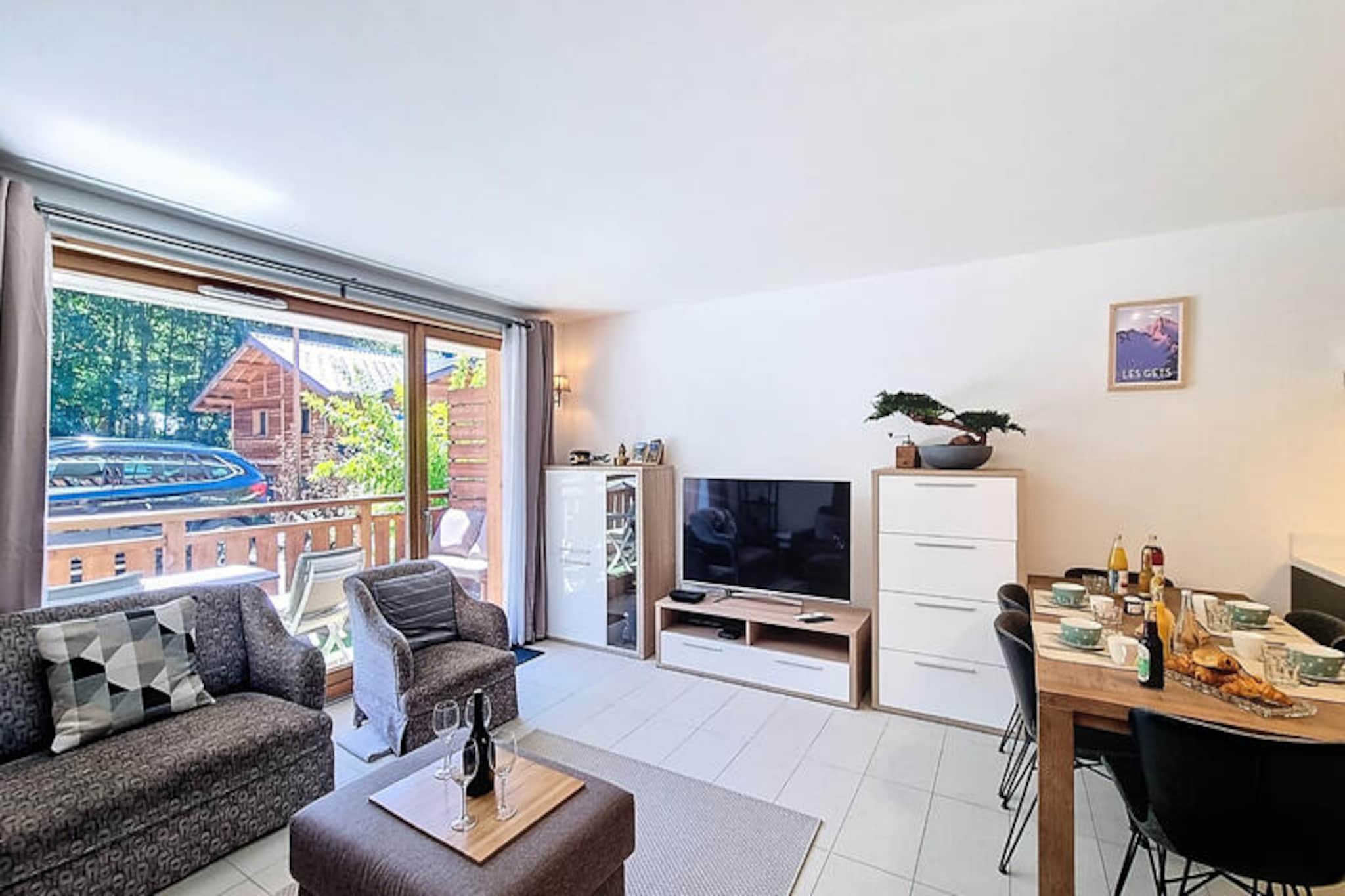 In the picturesque village of Les Gets, where the charm of the French Alps meets modern comfort, this delightful 64m² apartment offers a serene retreat for families and mountain enthusiasts alike. Imagine waking up to the crisp alpine air, stepping onto your private balcony, and taking in the breathtaking views of the surrounding peaks—a perfect start to your day in this idyllic setting. \n\nDesigned to accommodate up to four guests, the apartment features two cozy bedrooms: one with a plush double bed and the other with two comfortable single beds. The fully equipped kitchen invites you to prepare hearty meals, complete with a refrigerator, oven, dishwasher, coffee maker, and all the utensils you’ll need. After a day of adventure, unwind in the inviting living area with WiFi and television for your entertainment. The private covered parking ensures your vehicle is secure and easily accessible throughout your stay.\n\nLocated just 400 meters from the Perrières chairlift, this property is an ideal base for exploring the extensive ski slopes in winter or hiking and mountain biking trails in summer. A Sherpa supermarket is conveniently situated only 350 meters away, and the village center offers a variety of restaurants, shops, and services to enhance your stay.\n\nWhether you’re seeking thrilling outdoor activities or peaceful moments surrounded by nature, this apartment provides the perfect balance of relaxation and adventure. Book your escape to Les Gets today and create unforgettable memories in the heart of the Alps.