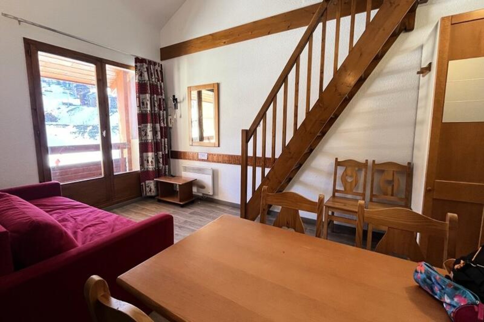 Basking in the golden sunlight of the French Alps, this charming 2-bedroom apartment in Plagne Soleil offers a serene escape with breathtaking views of the Grande Rochette and surrounding mountain ranges. Situated in the heart of the ski area, this residence is a haven for winter sports enthusiasts and nature lovers alike, with slopes and pedestrian trails right at your doorstep. Whether you’re seeking thrilling alpine adventures or tranquil walks amidst snowy landscapes, this location promises an unforgettable experience. 
 
 The apartment spans 39m² and comfortably accommodates up to six guests. Its bright living room features a cozy double sofa bed and a television, perfect for unwinding after a day on the slopes. The well-equipped kitchen includes a dishwasher, microwave, ceramic hob, and refrigerator, making meal preparation a breeze. The sleeping arrangements are thoughtfully designed, with a single bed in the first bedroom, a double and single bed in the upstairs second bedroom, and an additional single bed on the mezzanine. A bathroom with a bathtub and a separate toilet add to the convenience. Modern amenities such as WiFi, a ski locker, and a travel cot ensure a comfortable and hassle-free stay. 
 
 Plagne Soleil lives up to its name with its sunny disposition and ideal location. The resort offers a free shuttle service connecting Plagne Soleil to Plagne Village, making it easy to explore the area. Nearby shops, restaurants, and ski facilities provide everything you need for a seamless holiday. In summer, the region transforms into a paradise of hiking trails and alpine beauty, offering year-round appeal. 
 
 Whether you’re here to carve through fresh powder or soak in the tranquil mountain atmosphere, this apartment is the perfect base for your alpine getaway. Let the majestic Grande Rochette and the charm of Plagne Soleil set the stage for your next adventure.