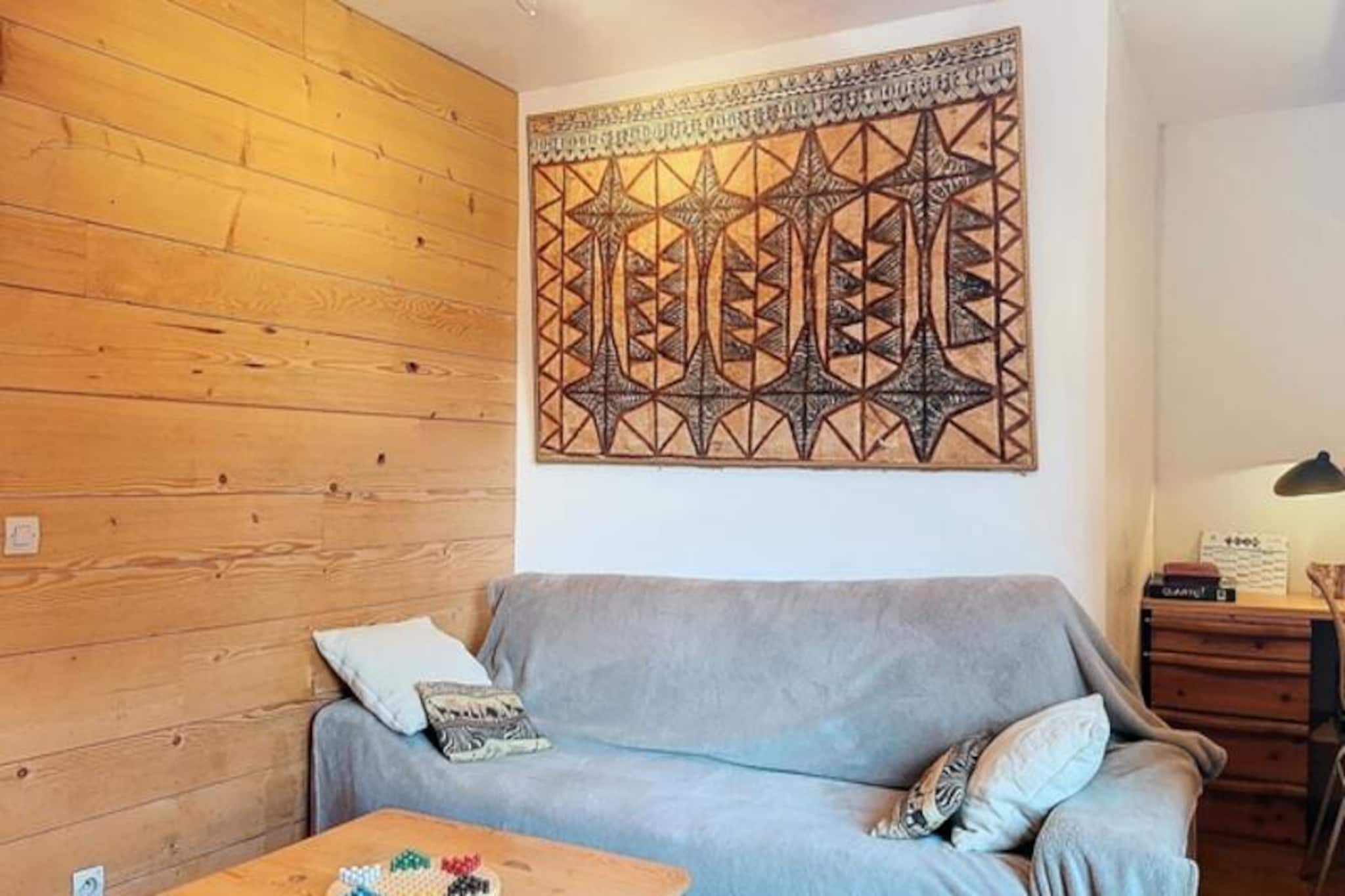 In the heart of the breathtaking French Alps, this elegant 2-bedroom apartment in Val d'Isère offers a serene escape for travelers seeking both adventure and relaxation. Situated on the 3rd floor of the L'Adonis B residence, the property is perfectly positioned near the resort center and conveniently served by free shuttle buses, making it an ideal base for exploring the iconic slopes and vibrant village life. The southwest-facing balcony invites you to unwind with stunning views of the alpine landscape, bathed in golden sunlight throughout the day. \n\nDesigned with comfort and style in mind, the apartment spans 63 m² and accommodates up to four guests. The living room features a cozy lounge area, a dining space, and a desk for those who need to stay connected. Modern amenities include Wi-Fi and a flat-screen TV, ensuring entertainment and convenience during your stay. The fully equipped kitchen boasts a dishwasher, refrigerator with freezer compartment, and oven, making it easy to prepare hearty meals after a day on the slopes. The sleeping arrangements include a tranquil bedroom with a double bed, complemented by a separate WC and a bathroom for added privacy. Additional amenities such as a washing machine and provided linens enhance the comfort of your stay. \n\nVal d'Isère is a haven for winter sports enthusiasts, offering preferential rates on ski passes for the Tignes and Val d'Isère domains. Beyond skiing, the village brims with charming boutiques, gourmet restaurants, and lively après-ski spots. In summer, the region transforms into a paradise for hikers and mountain bikers, with trails that reveal the untouched beauty of the surrounding peaks. \n\nWhether you’re here for the thrill of the slopes or the tranquility of alpine summers, this apartment promises a hassle-free and unforgettable stay. With hotel-style cleaning services available and beds made upon arrival, you’ll feel right at home in this picturesque mountain retreat.