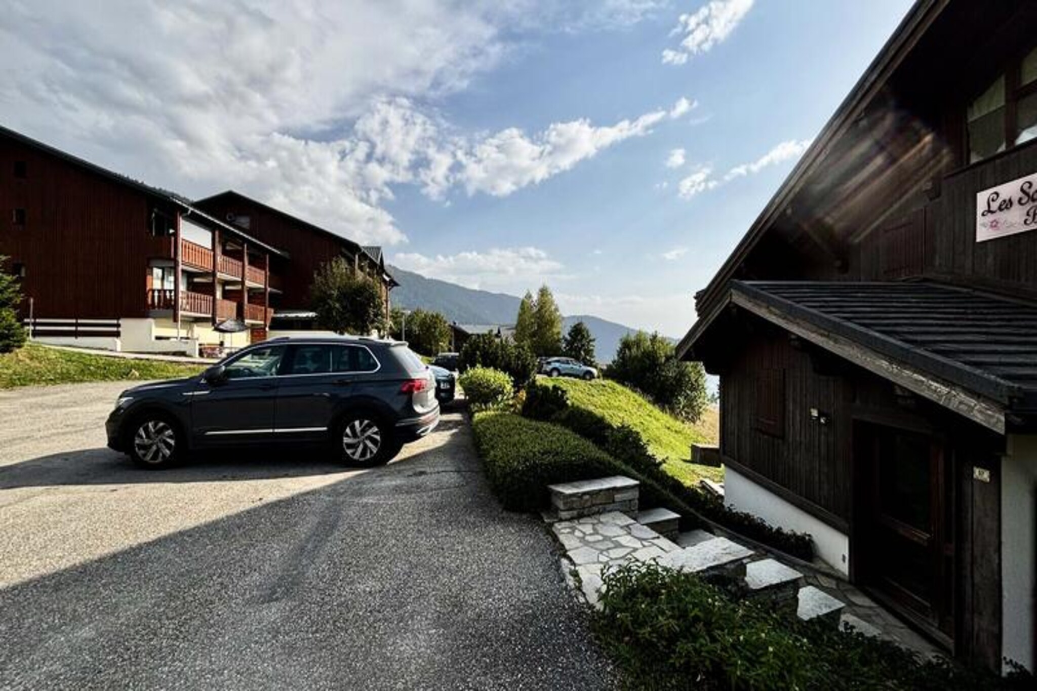In the heart of the picturesque Arly Valley, this charming apartment in the Les Sorbiers residence offers a serene mountain escape with breathtaking views of Mont Charvin. Positioned just 500 meters from the Espace Diamant ski area and the Cernix chairlift, it’s the perfect base for skiers and families looking to explore 192 km of interconnected slopes across six delightful village resorts. The west-facing terrace invites you to unwind with stunning sunsets after a day of alpine adventures.
The apartment accommodates up to 6/7 guests and features a thoughtfully designed layout for comfort and convenience. The living area includes a cozy lounge with a sofa bed, a dining space with a television, and a fully equipped open-plan kitchen complete with modern appliances such as an induction hob, oven, dishwasher, and washer/dryer. Two inviting bedrooms provide restful retreats: one with a double bed and the other with a bunk bed (double below, single above). A private ski locker and outdoor parking add to the ease of your stay.
Beyond the slopes, the village of Crest-Voland charms with its authentic alpine atmosphere, local shops, and a vibrant central market hall at Place du Cernix. In summer, enjoy scenic hikes, mountain bike trails, and the nearby Flumet lake for leisurely days by the water. The Logère chairlift, just minutes away, offers panoramic views of Mont Blanc and the Aravis range, making it a must-visit for nature lovers.
Whether you’re savoring Michelin-starred cuisine in the Val d’Arly or exploring nearby gems like Annecy, Megève, and Chamonix, this apartment is your gateway to unforgettable mountain memories. A peaceful retreat with all the comforts of home, it’s the ideal choice for your next alpine holiday.