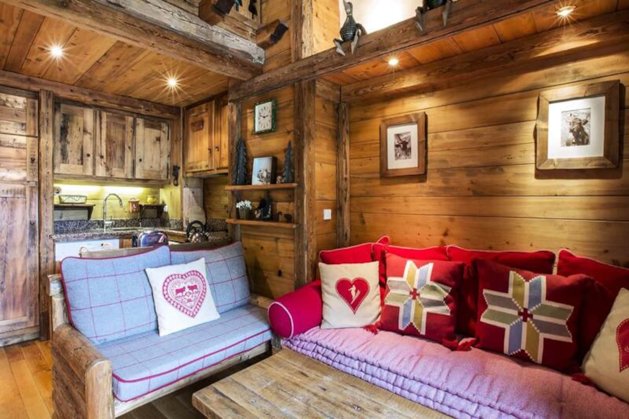 In the heart of Val d'Isère, Chalet Lecommandeur offers a harmonious blend of tranquility, breathtaking views, and direct access to the renowned Espace Killy ski area. Imagine waking up to the serene beauty of the Manchet Valley, stepping onto your private south-facing balcony, and breathing in the crisp alpine air before heading straight to the slopes just meters away. This charming duplex apartment is a haven for those seeking both adventure and relaxation in one of the most iconic ski destinations in the world. \n\nDesigned for up to five guests, the apartment spans two levels and features a cozy yet modern layout. On the first floor, you’ll find a fully equipped kitchen with a Nespresso coffee machine, a welcoming living room with an iPhone/iPod dock, and a bedroom with adaptable bedding options. The mezzanine level offers additional sleeping areas, including an attic alcove, and a second bathroom with a shower. Thoughtful amenities such as a boot dryer, ski locker, and daily cleaning services ensure a seamless stay. The apartment’s warm ambiance is complemented by high-quality furnishings and a touch of alpine charm. \n\nConveniently located near the Altitude Hotel and Rond-Point des Pistes, you’re just steps from the resort center, shops, and restaurants like Le Sun Bar and Etincelle, both offering stunning views of the Bellevarde Olympic Face. Non-skiers will appreciate the nearby Aquasportif Center, featuring a swimming pool, wellness facilities, and sports activities. For rainy days or quiet evenings, the new Val d'Isère cinema is just around the corner. \n\nWhether you’re here for the exhilarating slopes, the vibrant village life, or the serene mountain vistas, Chalet Lecommandeur promises an unforgettable alpine escape. Book your stay and immerse yourself in the magic of Val d'Isère.