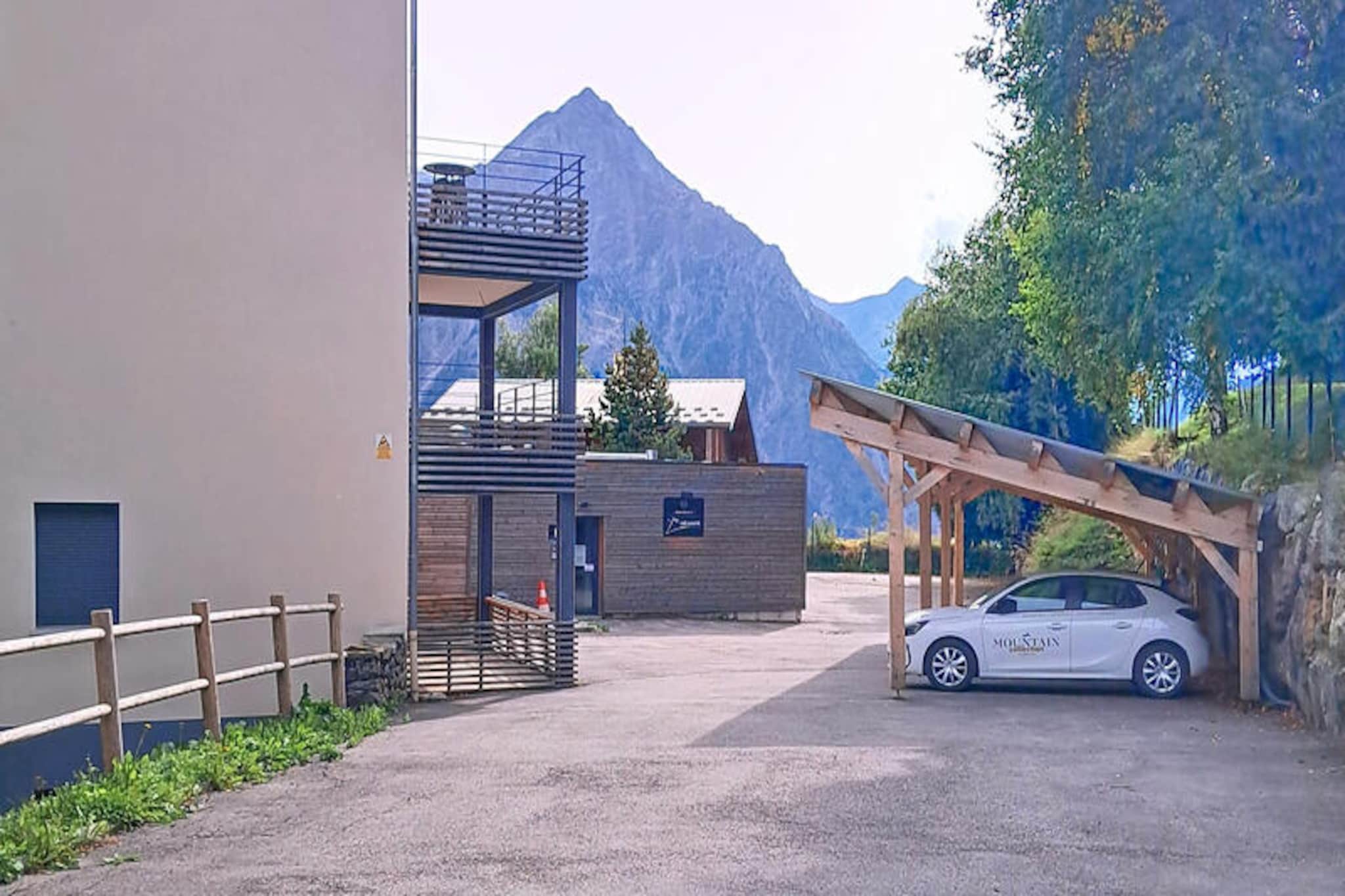 In the charming Alpe de Venosc district, the La Mariande residence offers a serene alpine retreat with breathtaking views of the iconic Muzelle glacier. This cozy and well-designed condominium combines modern convenience with the natural beauty of the French Alps, creating a perfect haven for your next holiday. Whether you're seeking thrilling outdoor adventures or peaceful relaxation, this location has it all. \n\nThis 55m² two-bedroom apartment comfortably accommodates up to six guests and is thoughtfully designed for both comfort and practicality. The main bedroom features a plush double bed and built-in wardrobe, while the second bedroom offers two single beds and ample storage. The inviting living room, complete with a comfortable sofa and television, opens directly onto a private south-facing garden, equipped with sun loungers, a table, and chairs for al fresco dining. The modern kitchen is fully equipped with a ceramic hob, oven, microwave, dishwasher, and a Nespresso coffee machine, ensuring you have everything you need to prepare delicious meals. A sleek bathroom with a walk-in shower and a separate WC complete the space, all finished with elegant tiled flooring. \n\nPerfectly situated just 450 meters from the Diable gondola lift, you’ll enjoy quick and easy access to the slopes. The nearby Place de Venosc, only 150 meters away, offers a variety of shops, bars, and restaurants, while a free shuttle bus just 100 meters from the residence connects you to the vibrant center of Les Deux Alpes. After a day of skiing, hiking, or exploring, return to your private parking space, complete with an electric vehicle charging point, and unwind in the comfort of your alpine sanctuary. \n\nWhether you're here to carve through powdery slopes, explore scenic trails, or simply soak in the stunning mountain views, La Mariande promises an unforgettable holiday experience in the heart of the Alps.