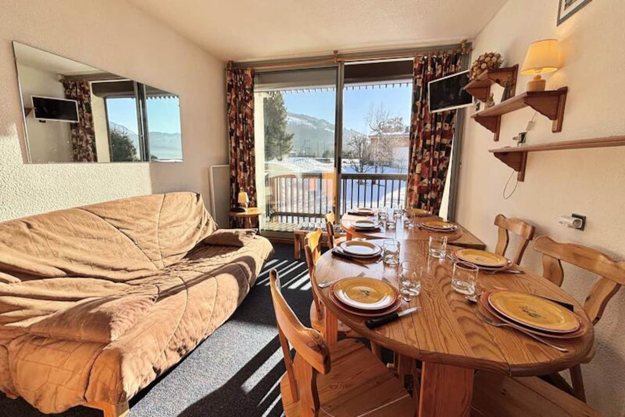 High above the Tarentaise Valley, this charming holiday apartment offers a perfect blend of alpine comfort and convenience. Wake up to breathtaking mountain views from the spacious corner balcony and step into a world of adventure just outside your door. Whether you're here to carve through powdery slopes in winter or bask in the summer sun by the private pool, this retreat promises unforgettable moments in the heart of the French Alps. \n\nThe 49 m² apartment is thoughtfully designed to accommodate up to eight guests. It features a cozy cabin bedroom with bunk beds, a second bedroom with a double bed and additional bunk beds (note: the top bunk is not suitable for children under six), and a living room with a double sofa bed. The open-plan kitchen invites you to prepare hearty meals after a day of exploration, while the separate bathroom, shower room, and WC ensure comfort and privacy for everyone. With elevator access, a ski locker, and optional private garage rental, every detail has been considered to make your stay seamless. \n\nLocated just 50 meters from the ESF ski school and ticket offices, and 100 meters from the town center, you'll find everything you need within easy reach. In summer, enjoy the on-site tennis court and outdoor swimming pool, or explore the surrounding trails and natural beauty. The large parking area at the foot of the building adds to the convenience, making this property a fantastic base for your alpine adventures. \n\nWhether you're seeking thrilling ski days, serene summer escapes, or a cozy retreat with loved ones, this apartment is the perfect choice. With its unbeatable location and welcoming amenities, it's time to create lasting memories in the picturesque French Alps.