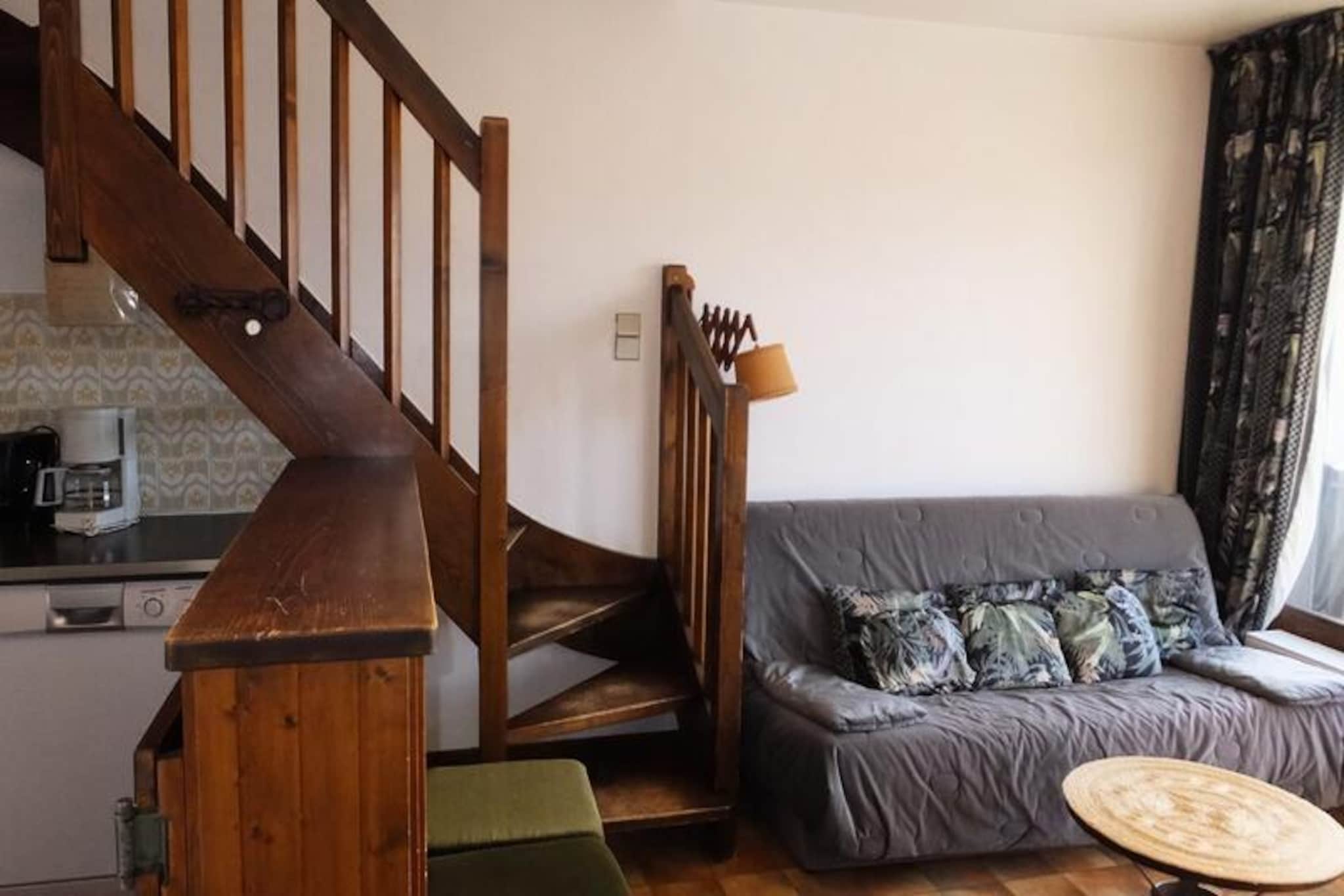 In the heart of the picturesque village of Praz-sur-Arly, this charming holiday apartment offers a serene retreat surrounded by the majestic beauty of the French Alps. With its sunny location and tranquil atmosphere, it’s the perfect base for exploring the region’s renowned slopes and trails. Imagine waking up to crisp alpine air and stepping onto your private balcony to take in the breathtaking views of the surrounding peaks. This inviting residence combines the charm of mountain living with modern conveniences for a truly memorable stay. \n\nThe apartment spans approximately 39 m² and is thoughtfully designed for comfort and practicality. On the first floor, accessible by elevator, you’ll find a cozy living room with a sofa bed for two and direct access to the balcony. The kitchenette is equipped for preparing meals after a day of adventure. Upstairs, a spacious bedroom features four single beds, a bathroom, and a separate toilet, making it ideal for families or small groups. Additional amenities include a ski locker and access to a parking lot, ensuring convenience throughout your stay. Optional services such as bed linen, towels, and end-of-stay cleaning are available to enhance your experience. \n\nLocated just moments from the slopes, this residence is perfect for winter sports enthusiasts and nature lovers alike. Whether you’re skiing down pristine runs or hiking through lush summer trails, the surrounding area offers endless opportunities for outdoor adventure. The village itself boasts charming shops, cozy restaurants, and a welcoming alpine ambiance that captures the essence of mountain life. \n\nChoose this delightful apartment for your next getaway and immerse yourself in the enchanting landscapes of Praz-sur-Arly. With its blend of comfort, convenience, and unbeatable location, it’s the ideal setting for creating unforgettable memories in the French Alps.