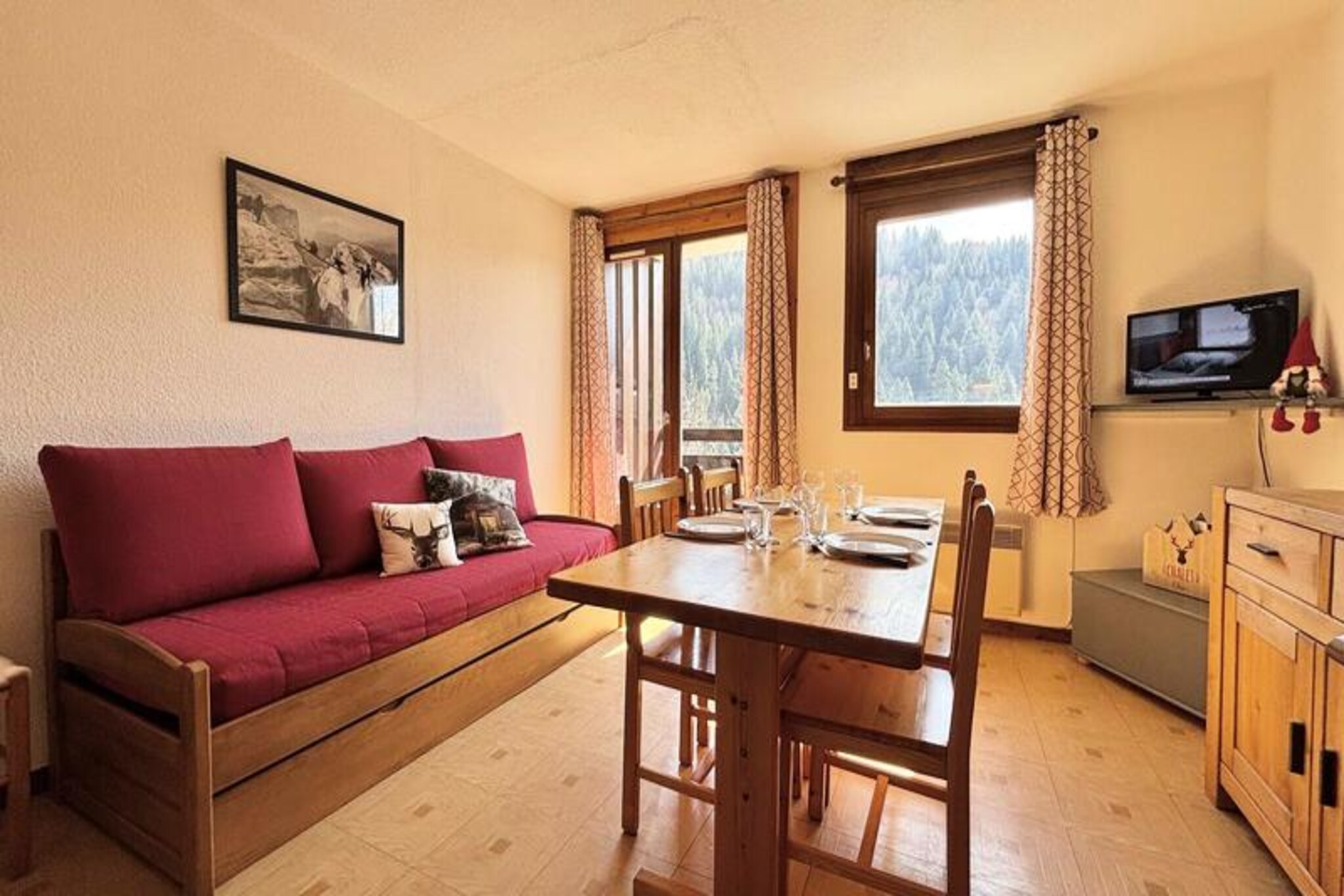 In the heart of the French Alps, where snow-dusted peaks meet serene alpine charm, this delightful studio apartment offers a cozy retreat for your mountain getaway. Situated on the first floor, this 25m² accommodation is perfect for couples or small families seeking a tranquil base close to the action. With its warm and inviting atmosphere, it’s a haven for relaxation after a day of exploring the breathtaking surroundings. The balcony provides a peaceful spot to enjoy fresh mountain air and take in the scenic views. \n\nInside, the studio is thoughtfully designed to maximize comfort and functionality. The entrance features a sleeping alcove with two bunk beds, ideal for children or additional guests, while the living room offers two single beds for restful nights. The kitchenette is fully equipped, allowing you to prepare hearty meals to fuel your adventures. A separate bathroom and toilet ensure convenience, and the ski locker and covered parking space add practicality to your stay. Please note that the upper bunk is not suitable for children under six years old.\n\nLocated just 400 meters from the village shops and 600 meters from the ski school and slopes, the apartment provides easy access to everything you need for a memorable holiday. A free shuttle service stops just steps from the residence, whisking you to the slopes in minutes. Whether you’re here for skiing, snowboarding, or simply soaking in the alpine beauty, this location is ideal for immersing yourself in the region’s charm.\n\nWith additional services like bed linen, towels, and cleaning available upon request, this studio ensures a comfortable and hassle-free stay. Create unforgettable memories in this cozy retreat, surrounded by the majestic beauty of the French Alps.