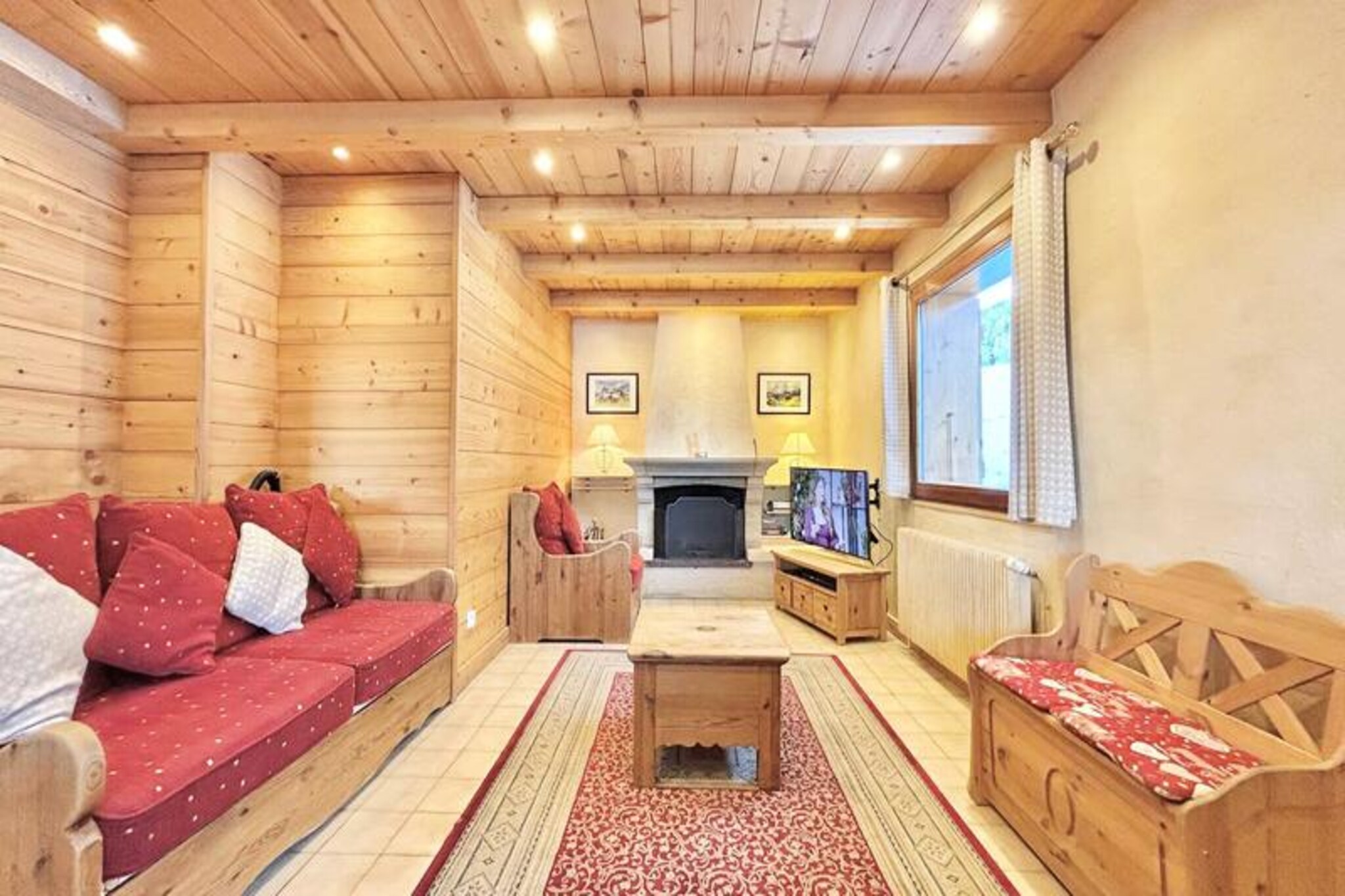 Amid the serene beauty of Mont Rond, this charming detached chalet offers a perfect blend of alpine tradition and modern comfort. Imagine waking up to the crisp mountain air, stepping onto your east-facing terrace, and soaking in the breathtaking views of the surrounding peaks. With its warm wooden interiors and cozy fireplace, this chalet invites you to unwind and embrace the tranquility of the French Alps, whether you're here for winter sports or summer adventures. Its location, just 800 meters from the ski lifts and local amenities, ensures convenience without compromising on peace and privacy. \n\nSpanning approximately 170m², the chalet is thoughtfully designed to accommodate up to 12 guests. The ground floor features a spacious living and dining area with a fireplace, a fully equipped kitchen, and a shower room with a separate toilet. Upstairs, you'll find four inviting bedrooms, including one with bunk beds and twin beds, and three with double beds, ensuring restful nights for everyone. The garden level adds a touch of luxury with a TV room, laundry facilities, ski and bike storage, and a wellness area complete with a spa, sauna, and shower. \n\nMont Rond offers a wealth of activities year-round. In winter, the nearby ski lifts provide access to pristine slopes, while summer transforms the area into a haven for hiking, cycling, and exploring the lush alpine landscapes. Local amenities, including shops and restaurants, are within easy reach, making it effortless to enjoy the best of the region. \n\nWhether you're seeking adventure or relaxation, this 3-star chalet promises an unforgettable stay. With end-of-stay cleaning included and optional services like bed linen and towels, your holiday is designed for ease and enjoyment. Welcome to your alpine escape, where every moment is a memory in the making.