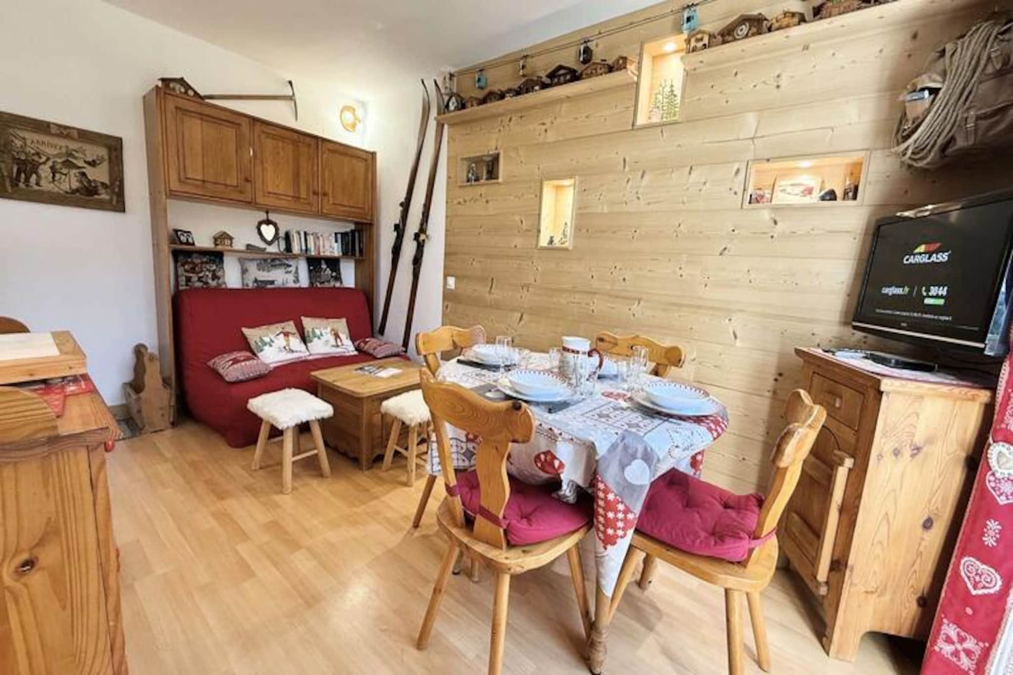 Amidst the serene charm of Notre-Dame-de-Bellecombe, this cozy ground-floor apartment invites you to experience the perfect alpine getaway. Imagine waking up to crisp mountain air, with the village center just 20 meters away and the ski slopes a mere 300 meters from your doorstep. Whether you're here for winter adventures or summer tranquility, this property offers a harmonious blend of convenience and comfort in the heart of the French Alps. \n\nSpanning 43 m², the apartment is thoughtfully designed to accommodate up to six guests. It features a fully equipped kitchen with a dining table, a warm and inviting living room with a sofa bed, and two bedrooms—one with a double bed and another with bunk beds (top bunk not suitable for children under six). A modern shower room and separate toilet complete the layout, ensuring practicality for families or small groups. Additional amenities include a reserved outdoor parking space and a ski storage area, making it easy to transition from cozy mornings indoors to thrilling days on the slopes. \n\nNotre-Dame-de-Bellecombe offers a quintessential alpine experience, with local shops, restaurants, and the ESF ski school at Le Reguet all within walking distance. In winter, the nearby slopes promise exhilarating ski runs, while summer unveils lush trails perfect for hiking and cycling. The surrounding region is rich in natural beauty, with breathtaking views and opportunities for outdoor exploration. \n\nWhether you're seeking adventure or relaxation, this apartment is your gateway to unforgettable moments in the Alps. With its prime location and welcoming ambiance, it’s the ideal retreat for creating cherished memories year-round.