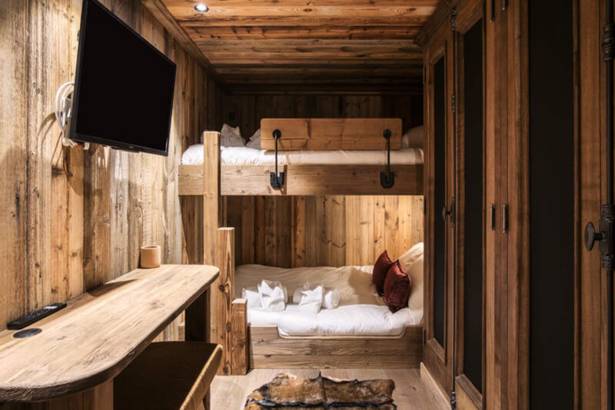 In the picturesque village of Le Raffort, where the charm of traditional alpine architecture meets the convenience of modern ski access, Chalet Edel offers an unforgettable mountain retreat. Just a short walk from the Olympe gondola lift, this semi-detached chalet is perfectly positioned for exploring the world-renowned Méribel ski area and the expansive Three Valleys. Whether you're here for the thrill of the slopes or the serenity of the snow-covered landscapes, this chalet is your gateway to an exceptional alpine experience. 
 
 Spanning 157 m², Chalet Edel comfortably accommodates up to 10 guests across its 4 bedrooms and dormitory. The ground floor features two en suite double bedrooms, a dormitory with a bunk bed, and a separate shower room. The first floor is designed for relaxation, with a cozy living room centered around a fireplace and a fully equipped kitchen ready for hearty home-cooked meals. The upper level boasts two luxurious en suite bedrooms, including a master suite with a private bathroom featuring both a bath and shower. Modern amenities like WiFi, a washing machine, and a dryer ensure a seamless stay, while thoughtful touches such as a personalized welcome with champagne, gourmet treats, and firewood add a touch of luxury. 
 
 The chalet's location is ideal for both skiers and non-skiers. The free ski bus, just 145 meters away, provides easy access to Méribel's town center, while the Le Raffort trail allows for a scenic return to the village. For those driving, ample free parking is available near the Golf chairlift or at the Rhodos covered parking lot. Beyond skiing, the area offers a wealth of activities, from snowshoeing through pristine forests to savoring local Savoyard cuisine in charming village restaurants. 
 
 Chalet Edel combines the warmth of a traditional alpine home with the convenience of modern amenities, making it the perfect choice for families and groups seeking a memorable mountain escape. With its prime location and exceptional services, your stay here promises to be as relaxing as it is exhilarating.