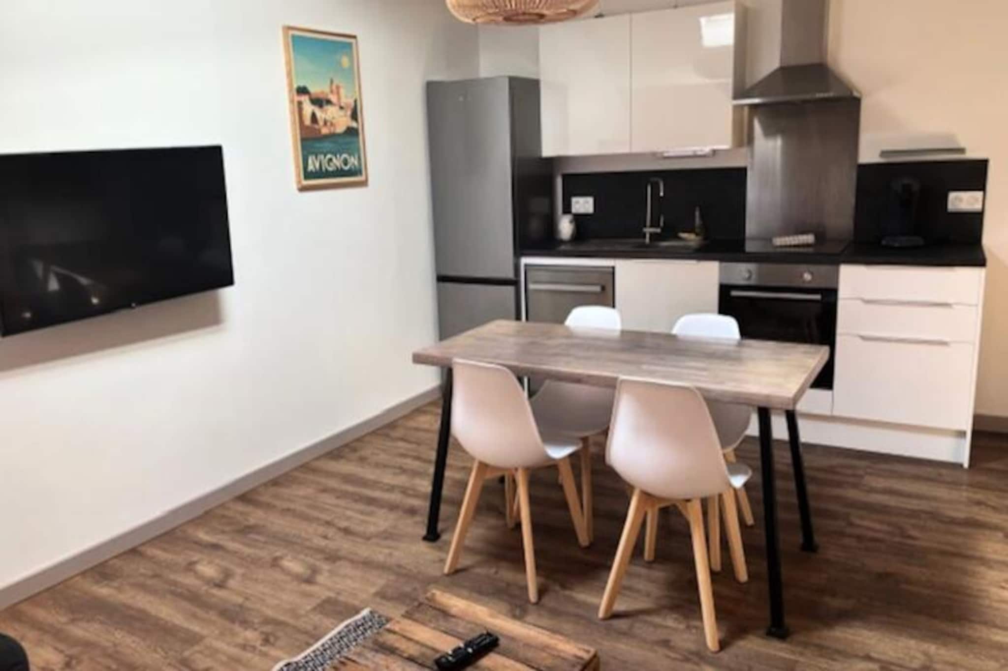 In the heart of L'Isle-sur-la-Sorgue, where the gentle flow of the Sorgue River meets the vibrant charm of Provence, this beautifully renovated apartment offers a serene escape for travelers seeking authenticity and elegance. Imagine waking up to the sounds of a bustling Provençal market, stepping out to explore antique shops, or enjoying a leisurely coffee at a riverside café. This is a place where every moment feels like a postcard come to life. 
 
 Inside, the apartment is a harmonious blend of modern comfort and timeless sophistication. With two spacious bedrooms featuring ample storage, a bright living room that seamlessly connects to a welcoming dining area, and a fully equipped kitchen, every detail has been thoughtfully designed to ensure a relaxing stay. The refined decor and soothing ambiance create a perfect retreat after a day of exploring. A stylish shower room completes the space, offering both functionality and charm. 
 
 Step outside, and you’re just moments away from the enchanting streets of L'Isle-sur-la-Sorgue. Stroll along the picturesque riverbanks, discover hidden gems in the town’s renowned antique shops, or immerse yourself in the lively atmosphere of the local markets. For those eager to explore further, the apartment is ideally located near the stunning perched villages of the Luberon, including Gordes, Ménerbes, and Roussillon, as well as the Alpilles and iconic destinations like Saint-Rémy-de-Provence and Les Baux-de-Provence. 
 
 Whether you’re drawn by the allure of Provence’s natural beauty, its rich history, or its culinary delights, this apartment offers the perfect base to experience it all. Unpack, unwind, and let the rhythm of Provence captivate your soul.