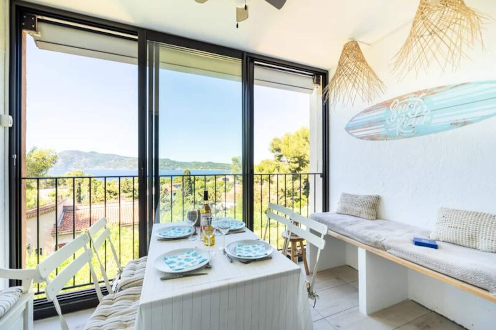 Perched on the serene heights of the Saint-Mandrier peninsula, this charming 36m² apartment offers a tranquil escape with breathtaking panoramic sea views. Surrounded by lush greenery and the scent of pine trees, this Provençal-style residence invites you to unwind in a peaceful haven where nature takes center stage. The sheltered loggia provides the perfect spot to enjoy meals or a glass of wine while gazing at the shimmering coastline and the iconic Twin Rocks in the distance. 
 
 The apartment is thoughtfully designed to accommodate up to six guests. It features a cozy double bedroom, a sleeping alcove with bunk beds ideal for children, and a bright living area with two pull-out beds. The fully equipped kitchen includes a refrigerator, dishwasher, washing machine, and a combination microwave/oven, making it easy to prepare meals after a day of exploring. Ceiling fans in the bedroom and loggia, along with tower fans in each room, ensure your comfort during warm summer days. 
 
 The Cap Soleil residence offers an array of amenities to enhance your stay, including two swimming pools, three tennis courts, a pétanque court, and table tennis facilities. For those seeking adventure, direct access to the coastal path and a nearby pebble cove awaits. The surrounding area is rich with attractions, from the vineyards of Var to the picturesque islands of Porquerolles and the historic Fort de Brégançon. 
 
 Whether you’re diving into the crystal-clear waters, exploring the charming Provençal villages, or simply soaking in the stunning sea views, this apartment is your gateway to an unforgettable Mediterranean getaway.