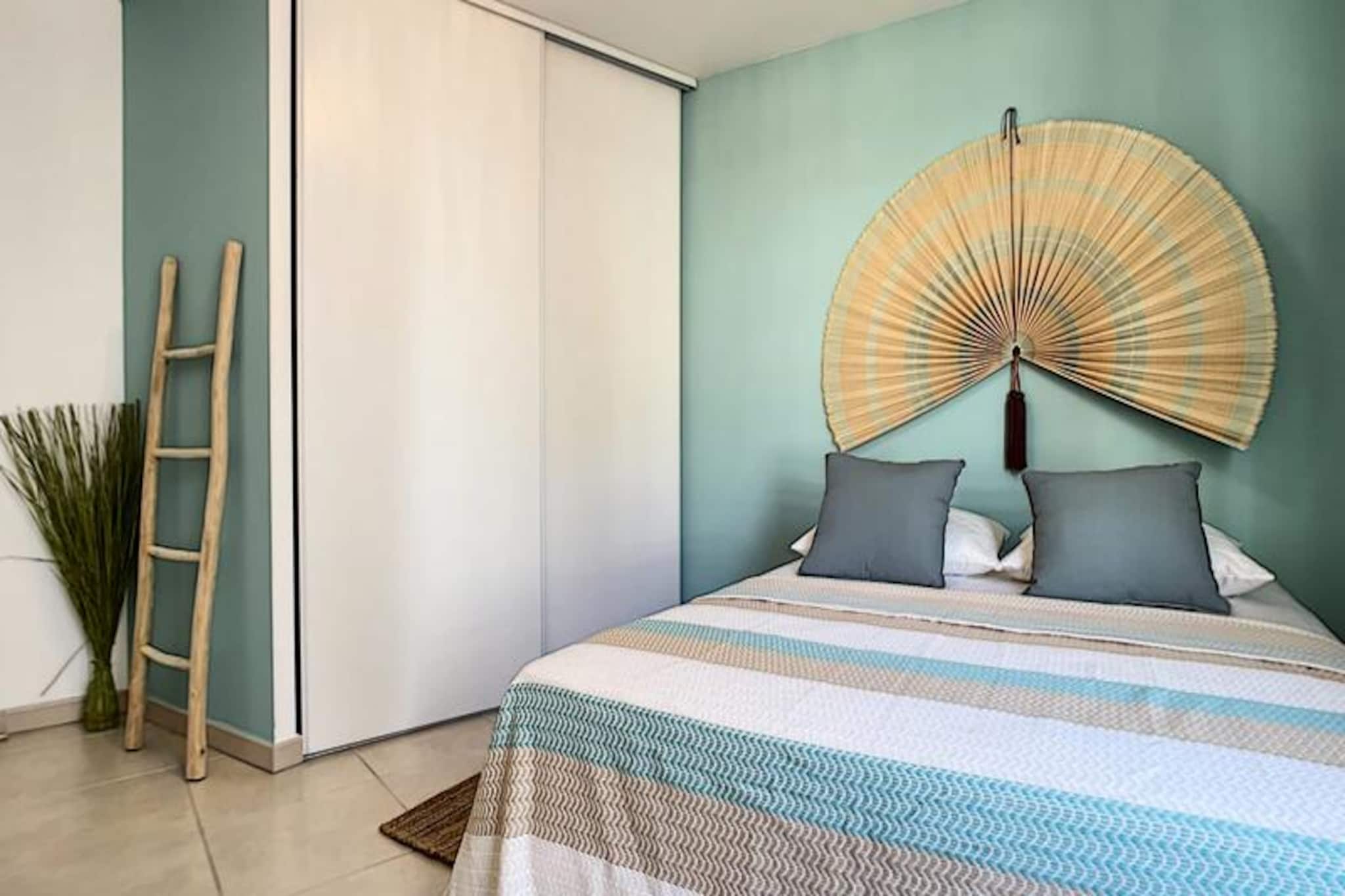 In the heart of Antibes, where the charm of the old town meets the allure of the Mediterranean, this serene two-bedroom apartment offers a tranquil retreat just moments from the sea. Tucked away on a quiet street, yet steps from vibrant markets, boutique shops, and golden beaches, it’s the perfect base for soaking in the Côte d'Azur’s timeless beauty. Recently renovated in calming shades of green and natural wood, the apartment exudes a harmonious atmosphere that invites relaxation. 

Spanning 72m², the space is thoughtfully designed for up to six guests. The bright living room opens onto a private, furnished terrace overlooking a peaceful courtyard, ideal for morning coffee or evening aperitifs. A fully equipped kitchen, complete with modern appliances such as a Nespresso machine and dishwasher, makes dining in a pleasure. The two spacious bedrooms feature large closets, with one offering a dedicated workspace. A stylish bathroom with a bathtub and double sinks, plus a separate toilet, ensures convenience and comfort. Air conditioning in every room and secure private parking add to the ease of your stay. 

Step outside, and you’re within walking distance of everything: the historic streets of Old Antibes, the sparkling shoreline, and a variety of cafes and restaurants. Explore the nearby Cap d’Antibes, Juan-les-Pins, or take a short trip to Cannes or the artistic villages of Vence and Saint-Paul-de-Vence. With Antibes train station and Nice Côte d'Azur Airport close by, this location is as practical as it is picturesque. 

Whether you’re here for a romantic getaway, a family holiday, or a cultural escape, this apartment combines modern comfort with the irresistible charm of the French Riviera. Your peaceful coastal retreat awaits.