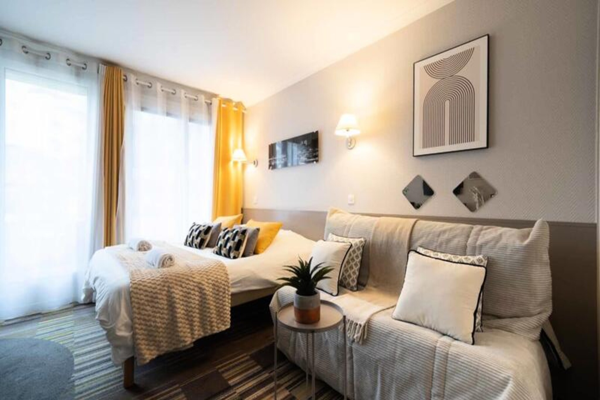 Immerse yourself in the charm of Paris with this bright and spacious studio apartment, perfectly situated just steps away from Porte de Versailles and Balard metro stations, as well as the tramway. Tucked away in a quiet residence, this first-floor retreat offers a serene escape from the bustling city while keeping you connected to its vibrant heart. Whether you're visiting for leisure or business, the nearby Parc des Expositions and the iconic sights of Paris are easily accessible, making this location ideal for any traveler. 
 
 This 26 m² studio is thoughtfully designed to combine comfort and practicality. The main living area features two single beds and a sofa bed, perfect for a small child, ensuring a cozy stay for up to two adults and one child. A fully equipped kitchenette with a Nespresso coffee machine, microwave, and kettle allows you to prepare meals at your convenience, while the private bathroom with a bathtub and separate toilet adds to the comfort. Enjoy your morning coffee on the balcony, which offers a peaceful, unobstructed view, a rare luxury in the city. Modern amenities such as a flat-screen TV with satellite channels and portable air conditioning ensure a comfortable stay year-round.
 
 The apartment is part of the 4-star Adagio Aparthotel residence, which offers a range of services to enhance your experience. Take advantage of the lounge/library, foosball table, laundry facilities, and vending machines for snacks. A buffet breakfast and private parking are available for an additional charge, adding convenience to your stay. The residence’s tranquil setting, just off the main street, is complemented by nearby shops, restaurants, and entertainment options in Issy-les-Moulineaux and Porte de Versailles. 
 
 With easy access to public transport, including metro lines 8 and 12 and the Porte d’Issy tram stop, exploring Paris has never been easier. Whether you're here to visit the Aquaboulevard water park, enjoy a film at the local cinemas, or attend an event at the Parc des Expositions, this apartment offers the perfect base for your Parisian adventure. Book your stay now and experience the best of Parisian comfort and convenience.