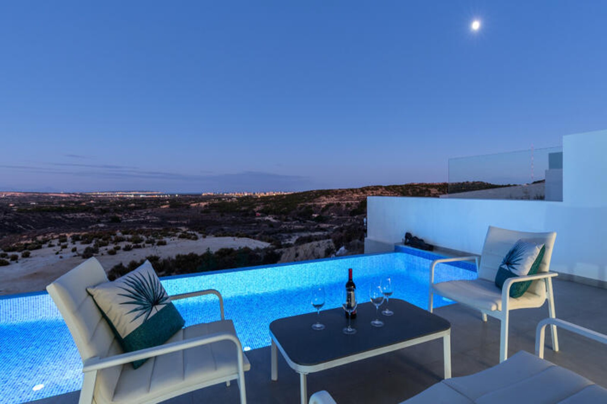 In the sunlit hills of Rojales, this luxurious villa offers an unparalleled retreat for those seeking tranquility and modern comfort near the Costa Blanca. With its sleek design, infinity pool, and breathtaking views, it’s a haven for relaxation and adventure alike. Whether you’re exploring the artistic Cuevas del Rodeo or enjoying a round at La Marquesa Golf Course, this villa places you at the heart of Rojales’ charm. 
 
 Inside, the villa boasts three spacious bedrooms, each thoughtfully designed for comfort and style. The open-plan living area invites you to unwind on oversized L-shaped sofas, while the fully equipped kitchen inspires culinary creativity. Smart TVs, high-speed Wi-Fi, and a billiards table add to the entertainment options, ensuring every moment is enjoyable. The bathrooms are equally indulgent, featuring walk-in showers and a bathtub for ultimate relaxation. 
 
 Step outside to the private patio, where the infinity pool glistens under the Spanish sun. Lounge on the sunbeds, savor a barbecue meal, or simply soak in the panoramic views of the surrounding hills. The villa’s pet-friendly policy and dedicated playroom make it perfect for families, while fitness enthusiasts can stay active with the on-site exercise equipment. 
 
 With attractions like the Mata-Torrevieja Natural Park and the vibrant weekly market just minutes away, this villa offers the perfect blend of luxury and local culture. Whether you’re here for the beaches, history, or simply to unwind, this Rojales retreat promises an unforgettable stay.