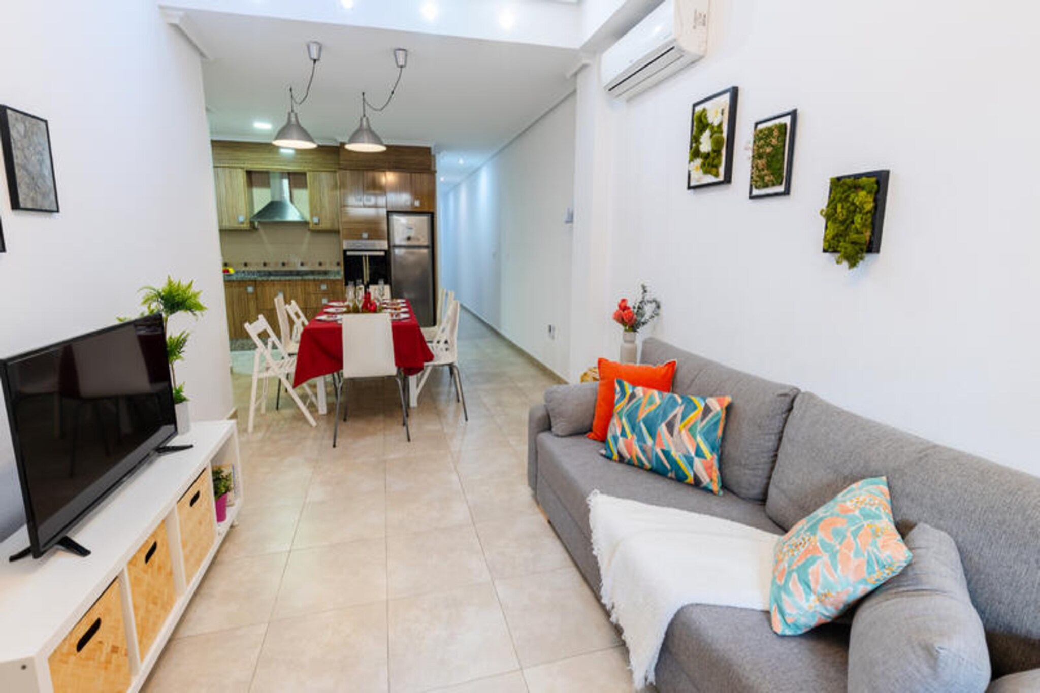 In the heart of Guardamar del Segura, where the Mediterranean breeze whispers through the streets, this modern apartment offers the perfect retreat for families and groups seeking a sun-soaked escape. Guardamar is renowned for its 15 kilometers of pristine white sandy beaches and vibrant local culture, making it an idyllic destination for relaxation and exploration. From your terrace, soak in the warm Spanish sun and enjoy the lively atmosphere of this charming coastal town. \n\nThe apartment boasts three spacious bedrooms and two full bathrooms, comfortably accommodating up to eight guests. Designed with both style and comfort in mind, the interiors feature tasteful furnishings and modern amenities. The open-plan kitchen, equipped with a ceramic hob, refrigerator, microwave, oven, and dishwasher, invites you to prepare delicious meals with fresh local ingredients. Additional conveniences such as Wi-Fi, air conditioning, a clothes dryer, and a private garage ensure a hassle-free stay. The 10 m² terrace is perfect for sipping your morning coffee or unwinding after a day of adventure.\n\nStep outside and find yourself within walking distance of everything you need. The stunning Playa de Guardamar beach is just 300 meters away, offering golden sands and crystal-clear waters. Explore the nearby Parque Reina Sofia, a tranquil natural park teeming with wildlife, or stroll to the local Mercadona supermarket and charming restaurants for a taste of authentic Mediterranean cuisine. For those seeking more adventure, the Torrevieja Water Park and the serene Lagunas de la Mata are just a short drive away.\n\nWhether you’re here to bask in the sun, explore the rich culture of the Costa Blanca, or simply relax with loved ones, this apartment provides the ideal base for an unforgettable holiday. Let the beauty of Guardamar del Segura captivate your heart and create memories that will last a lifetime.