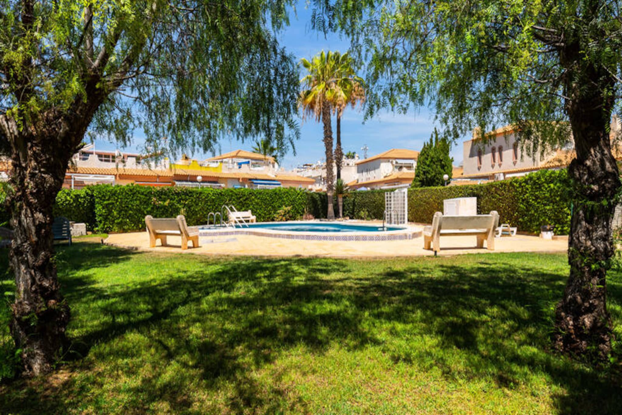 Just a short stroll from the golden sands of Punta Prima beach, this delightful apartment in Orihuela Costa offers a serene escape on Spain’s sunny Costa Blanca. Surrounded by lush communal gardens and Mediterranean charm, it’s the perfect retreat for families or couples seeking relaxation and convenience. Imagine waking up to the gentle sea breeze, enjoying breakfast on your private terrace, and spending your days exploring the nearby coastline or lounging by the sparkling communal pool.
This spacious two-bedroom apartment comfortably accommodates up to four guests and is thoughtfully designed for a stress-free holiday. Spread across two floors, it features a private entrance, a beautifully furnished 30 m² terrace, and access to a shared swimming pool. The separate kitchen is fully equipped with modern appliances, including a ceramic hob, refrigerator, oven, microwave, and even a juicer, ensuring you have everything you need to prepare delicious meals. Additional amenities such as Wi-Fi, satellite TV with international channels, and electric radiators for heating provide all the comforts of home.
Located within walking distance of shops, restaurants, and local attractions, this property is ideally situated for exploring the vibrant Orihuela Costa area. Whether you’re soaking up the sun on Punta Prima beach, enjoying fresh seafood at a nearby eatery, or discovering the region’s golf courses and nature trails, there’s something for everyone.
Choose this charming apartment for your next holiday and experience the best of the Costa Blanca. With its blend of comfort, style, and unbeatable location, it promises a memorable getaway for all.