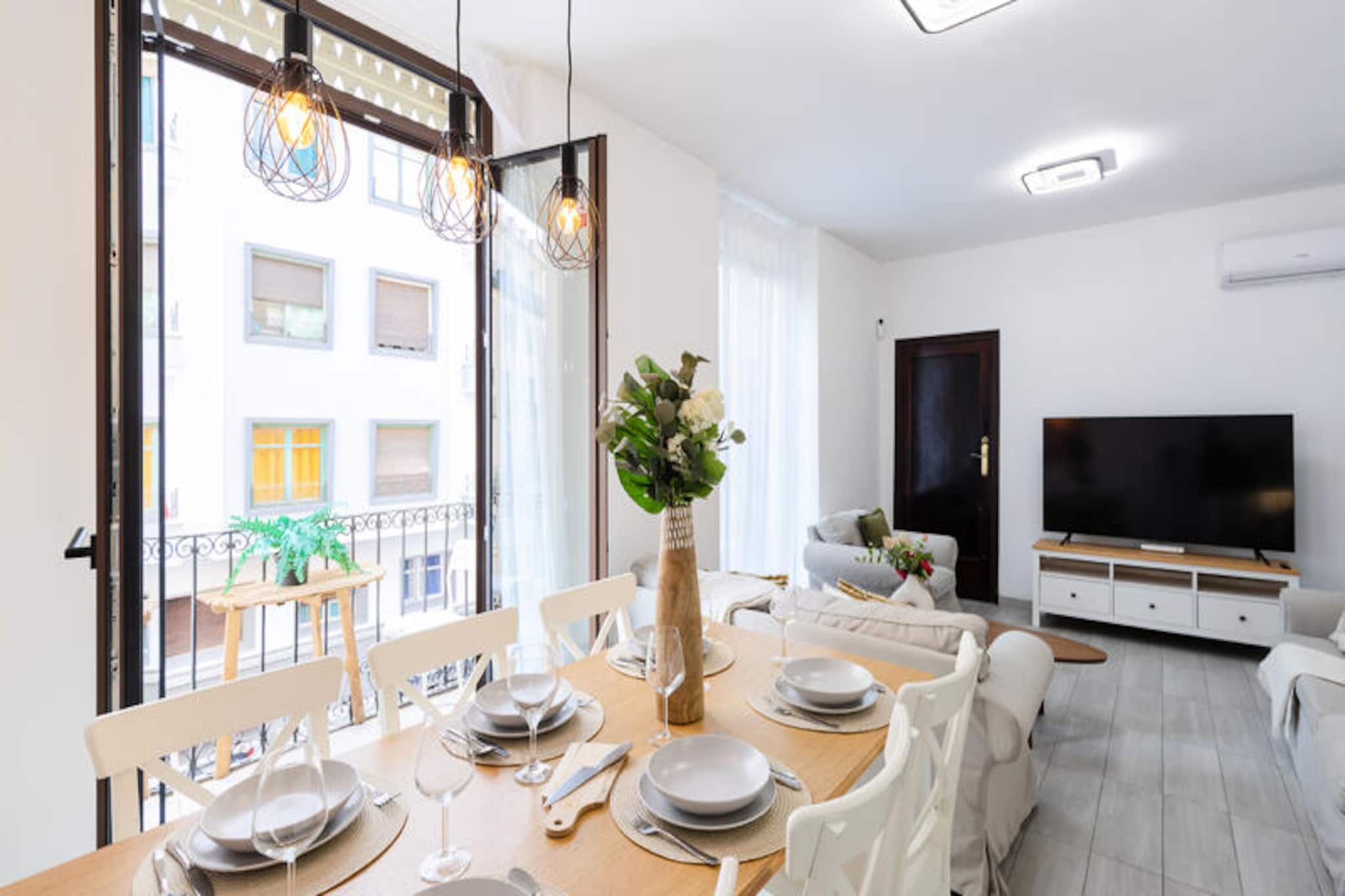 In the heart of Alicante, where the Mediterranean breeze mingles with the vibrant city rhythm, this spacious apartment offers a luxurious retreat for up to 12 guests. With its prime location just steps from the iconic Town Hall Square, the lively Explanada promenade, and the bustling marina, you’ll find yourself immersed in the charm and energy of this coastal gem. Whether you’re here to explore the historic streets, savor local cuisine, or simply unwind by the sea, this apartment is the perfect base for your Alicante adventure. \n\nDesigned with both comfort and elegance in mind, the apartment boasts six beautifully appointed bedrooms and four modern bathrooms, ensuring ample space for families or groups of friends. The open-plan kitchen is fully equipped, making it easy to prepare meals and share moments together. Recently renovated, the interiors feature a sleek, contemporary style complemented by climate-controlled windows for complete sound insulation and air conditioning throughout, ensuring a peaceful and pleasant stay even in the heart of the city. \n\nStep outside, and you’ll find Alicante’s most beloved attractions at your doorstep. Stroll along the Explanada, lined with palm trees and vibrant mosaic tiles, or explore the marina’s lively atmosphere with its array of restaurants and bars. For history enthusiasts, the Santa Bárbara Castle offers breathtaking views and a glimpse into the city’s rich past. Beach lovers will appreciate the proximity to Postiguet Beach, perfect for soaking up the sun or enjoying a refreshing dip in the sea. \n\nWhether you’re seeking cultural exploration, seaside relaxation, or a mix of both, this apartment provides the ideal setting for an unforgettable stay in Alicante. We look forward to welcoming you to this Mediterranean haven.