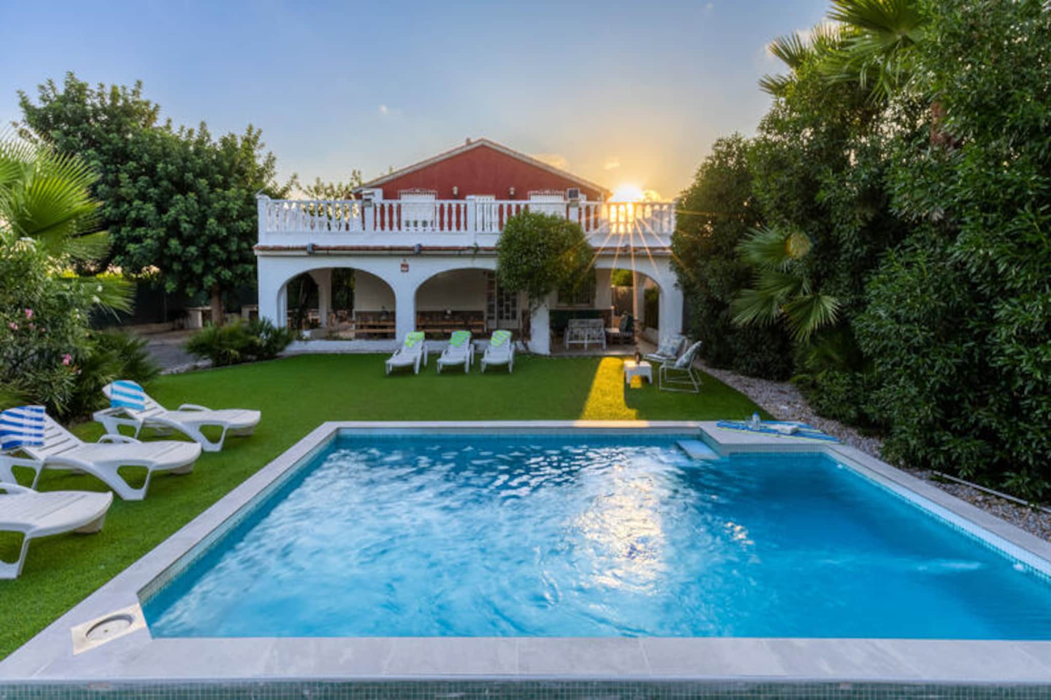 In the serene countryside near the charming town of Algorfa, this stunning villa promises a luxurious escape for families and friends alike. Just 15 minutes from the golden sands of Guardamar del Segura and 5 minutes from the renowned La Finca golf course, this property combines tranquility with convenience, offering easy access to the AP-7 motorway and the best of Costa Blanca. Whether you're seeking relaxation or adventure, this villa is your perfect retreat. 

Step inside to discover a spacious and elegantly designed interior. The living room, adorned with tasteful furnishings, exudes comfort and style, while air conditioning ensures a cool haven even on the warmest days. With accommodation for up to 19 guests, this villa is ideal for large gatherings, be it a family reunion or a getaway with friends. Every detail has been carefully considered to provide a seamless and enjoyable stay. 

The outdoor area is a true highlight, featuring a private pool surrounded by lush gardens. Lounge on a Balinese bed under the Mediterranean sun, or enjoy the shaded outdoor seating area with a refreshing breeze. A modern barbecue invites you to host unforgettable al fresco meals, while the play area ensures entertainment for guests of all ages. For quieter moments, the indoor lounge offers an elegant pool table for friendly games and relaxation. 

Practicality meets luxury with a large garage accommodating up to four vehicles, providing both convenience and security. Whether you're exploring the nearby beaches, perfecting your swing at the golf course, or simply unwinding in the villa's serene ambiance, this property offers an unparalleled holiday experience. We look forward to welcoming you to this exclusive haven, where every moment is designed to be unforgettable.