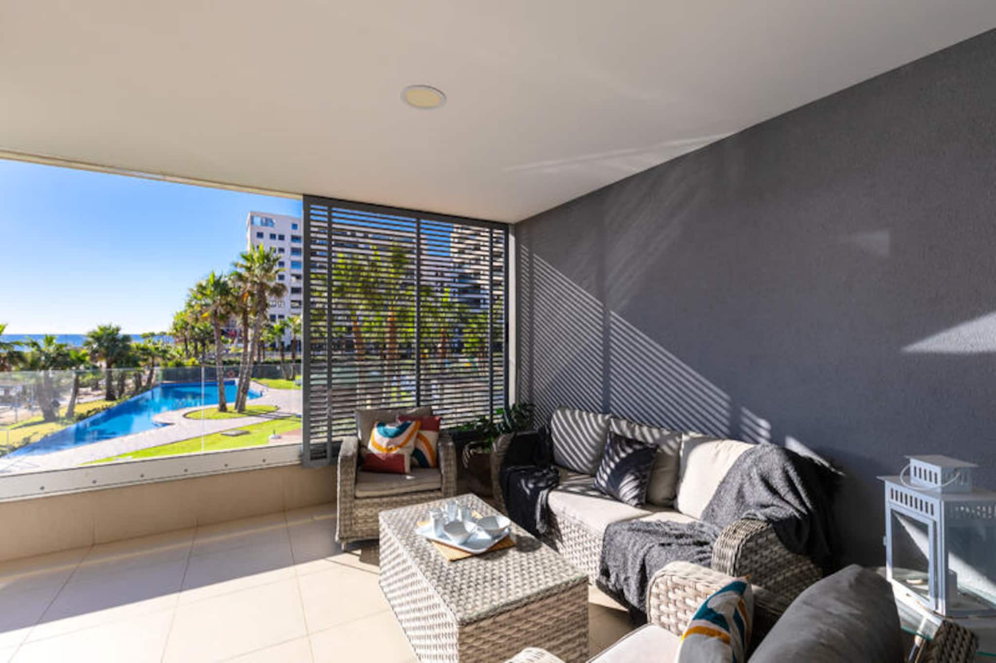 Imagine waking up to the gentle sound of waves and the sun rising over the Mediterranean Sea. This beachfront holiday home in Punta Prima, Torrevieja, offers a serene escape where comfort meets coastal charm. With its privileged location just steps from the sandy shores, this property invites you to immerse yourself in the beauty of the Costa Blanca. Whether you're seeking a family getaway or a retreat with friends, this home is designed to create unforgettable memories. \n\nInside, you'll find three elegantly decorated bedrooms, each thoughtfully designed to provide tranquility and restful nights. Accommodating up to six guests, the bright and airy interiors are complemented by stunning sea views that can be enjoyed from the privacy of your residence. Two fully equipped bathrooms ensure convenience for all, while the modern kitchen is perfect for preparing delicious meals to share in the cozy dining area. \n\nStep outside to discover spacious terraces overlooking the sea and the shared pool. Relax in the outdoor lounge, dine al fresco, or simply soak up the sun as the sea breeze refreshes your senses. For a more intimate experience, take a dip in the private pool or stroll just a few steps to the beach, where the golden sand and crystal-clear waters await. Air conditioning ensures your comfort year-round, making this property a perfect choice for any season. \n\nBeyond the property, Punta Prima offers a vibrant mix of local restaurants, shops, and attractions. Explore the wonders of Torrevieja, from its bustling marina to its charming streets filled with Mediterranean flair. Whether you’re here to unwind or to explore, this beachfront haven is your gateway to the magic of Costa Blanca. Book your stay today and let the beauty of Punta Prima captivate you.