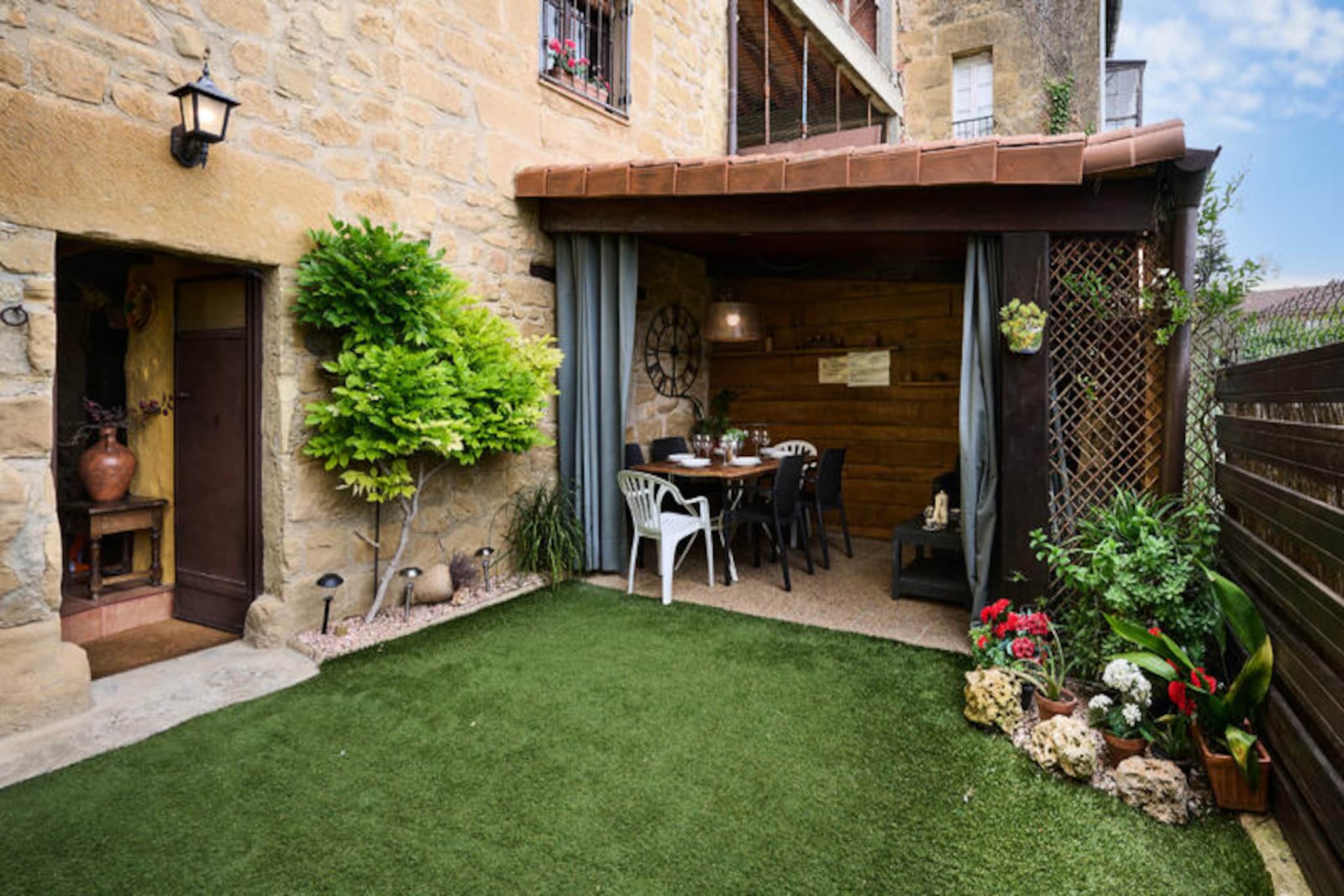 In the heart of Labastida’s historic charm, this enchanting 13th-century house offers a timeless retreat with breathtaking views of the Sierra de Ezcaray. Surrounded by the rich history of Rioja Alavesa, this property invites you to step back in time while enjoying modern comforts. Just a short stroll from iconic landmarks such as the Church of Notre-Dame de l’Assomption and the Hermitage of the Holy Christ, this home is a gateway to the cultural and architectural treasures of the region. 
 
 The house boasts a unique layout spread across three levels. On the ground floor, you’ll find a welcoming entrance hall leading to a traditional txoco—a cozy kitchen and dining area perfect for gatherings—which opens onto an outdoor terrace and a wine cellar steeped in history. A double bedroom and a convenient toilet complete this level. The first floor features a main kitchen, a snug living room, three double bedrooms, and two bathrooms, including an en-suite. The penthouse offers an open-plan living area and an additional bedroom with an en-suite bathroom, ideal for moments of relaxation and privacy.
 
 Outside, a charming garden with a covered porch provides a serene space to unwind, whether sipping local wine or enjoying the fresh air. The property’s wine cellar is a nod to the region’s renowned viticulture, with world-class wineries such as Bodegas Muga and Bodegas Marqués de Riscal just a short drive away. 
 
 Labastida is a treasure trove of history and wine culture, with its cobblestone streets, ancient city walls, and proximity to Haro’s celebrated bodegas. Whether you’re exploring the nearby palaces or indulging in the flavors of Rioja, this home offers an unforgettable blend of heritage and hospitality. Perfect for families, friends, or wine enthusiasts, this property promises an authentic and memorable stay in the heart of Spain’s wine country.