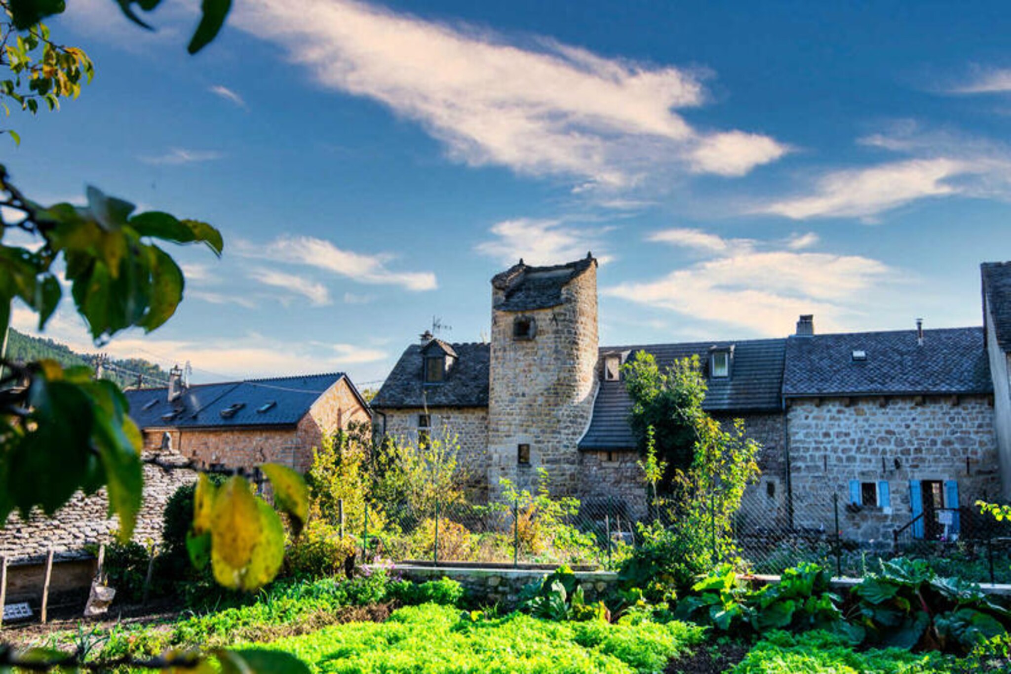 In the heart of the scenic Lozère region, where rolling hills meet the majestic Cévennes mountains, the Truc de Balduc gîte offers a tranquil escape steeped in history and charm. This lovingly restored former tower invites you to unwind in its serene private courtyard, surrounded by breathtaking landscapes perfect for hiking and cycling enthusiasts. Whether you’re seeking a peaceful retreat or an active adventure, this unique property provides the ideal setting for reconnecting with nature.
Inside, the gîte boasts a cozy and welcoming atmosphere. The first floor features a spacious common room with a pellet stove, television, and a fully equipped kitchen and dining area, perfect for sharing meals and moments with loved ones. Upstairs, you’ll find two thoughtfully arranged bedrooms: one with a double bed and another with two single beds that can be joined together, ensuring flexibility for families or friends. A separate toilet is conveniently located on the second floor, while the third floor houses a modern bathroom. For those who love dining al fresco, the outdoor area adjoining the cottage and the private garden just 50 meters away provide delightful spaces to enjoy the fresh mountain air.
Guests can also immerse themselves in local farm life, with the opportunity to visit the nearby farm and sample fresh yogurt and milk straight from the source. Shared amenities include a swimming pool located 15 kilometers away, while free Wi-Fi and nearby parking ensure convenience throughout your stay. With heating, towels, bed linen, and household linen included, you’ll feel right at home from the moment you arrive.
Whether you’re exploring Mont Lozère’s rugged trails or simply relaxing in the peaceful countryside, the Truc de Balduc gîte promises an unforgettable escape where nature and comfort harmoniously come together.