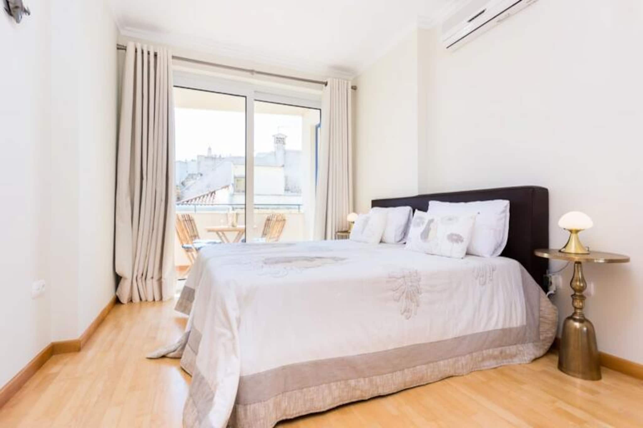 Awaken to the soothing sound of waves and the golden hues of the Algarve sun in this luxurious seaside apartment, perfectly situated just steps from the pristine sands of Meia Praia beach. Whether you're seeking a tranquil escape or an adventure-filled getaway, this modern retreat offers the ideal balance of comfort and convenience, with breathtaking views of the Atlantic Ocean as your daily backdrop.
Designed with style and relaxation in mind, the apartment features two spacious bedrooms, a sleek bathroom with a walk-in shower, and a fully equipped kitchen to make you feel at home. The private balcony invites you to savor your morning coffee while gazing at the ocean, while the shared rooftop pool, heated by the sun, provides a serene spot to unwind after a day of exploration. With amenities such as ergonomic mattresses, a curved screen TV, a dishwasher, and high-speed Wi-Fi, every detail has been thoughtfully curated to enhance your stay.
Step outside, and you'll find yourself immersed in the vibrant charm of Lagos. A short stroll takes you to the Marina, where lively bars, restaurants, and shops await. For those looking to explore, the historic center of Lagos offers cobblestone streets, local markets, and a rich cultural heritage. Adventure seekers can embark on boat tours, kayak along the dramatic cliffs, or try their hand at surfing. With its blend of natural beauty and modern amenities, this apartment is your gateway to the best of the Algarve.
Whether you're traveling with family, friends, or as a couple, this peaceful retreat promises unforgettable memories by the sea. Book your stay today and experience the magic of Meia Praia and Lagos firsthand.