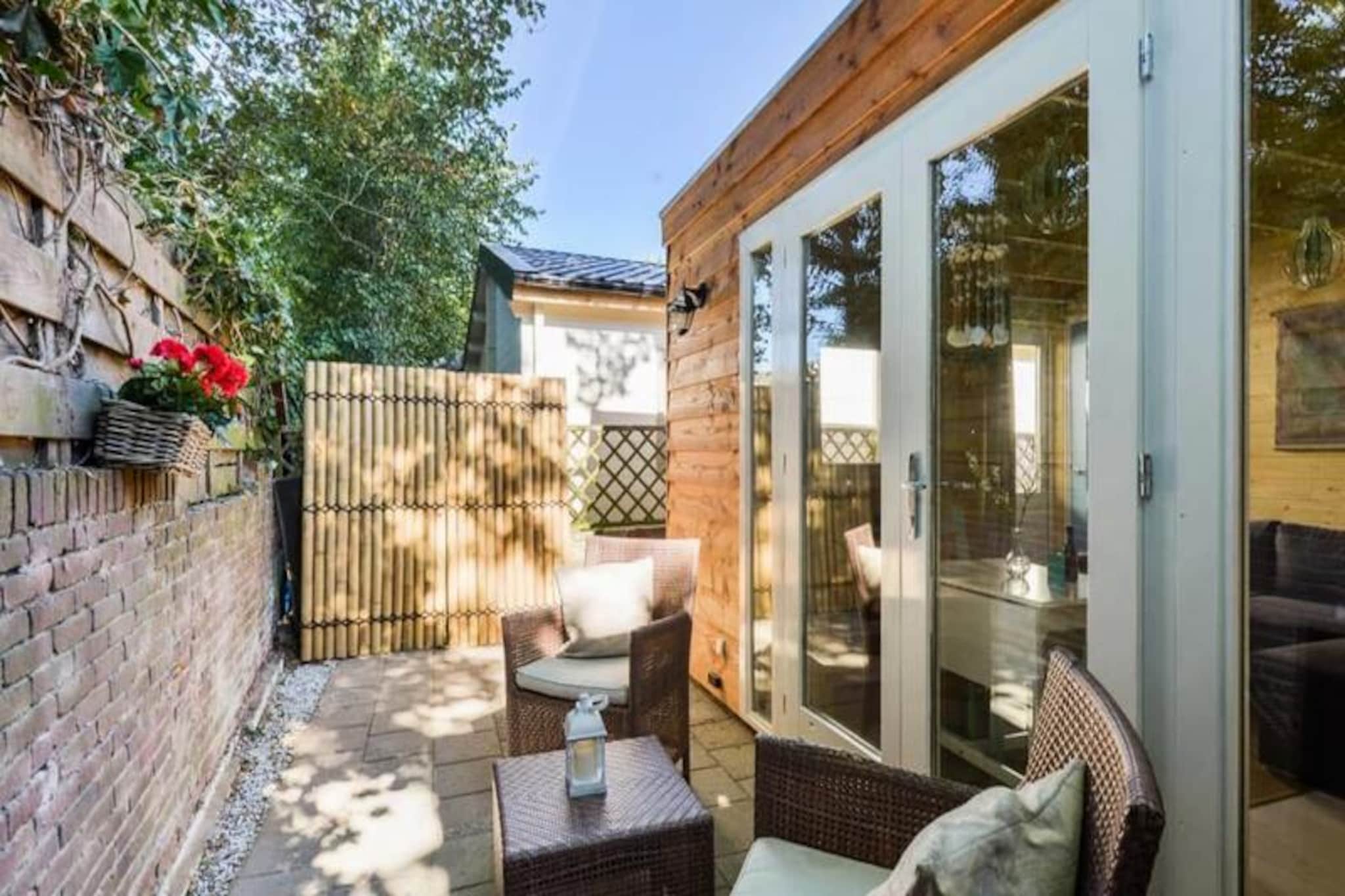 In the serene coastal town of Zandvoort, where the rhythm of the waves meets the charm of Dutch hospitality, this cozy lodge offers a tranquil escape for travelers seeking both relaxation and adventure. Surrounded by the beauty of nature and just moments from the beach, this tiny house is a hidden gem that promises a memorable stay. Whether you're here to unwind or explore, the lodge provides the perfect base for your journey. 
 
 Step inside and discover 35m² of thoughtfully designed private space. The lodge features a warm and inviting living room, a separate bedroom with a comfortable double bed, and a fully equipped kitchen where you can prepare your favorite meals. The bathroom, complete with a shower, ensures all the comforts of home. Outside, a charming terrace invites you to enjoy your morning coffee or an evening glass of wine in the fresh sea air. With space for up to three guests, it’s ideal for couples or small families. Free private parking, Wi-Fi, and provided linens and towels add to the convenience of your stay. 
 
 Zandvoort is a destination that offers something for everyone. Spend your days strolling along the sandy beaches, exploring the nearby national parks of De Waterleidingduinen and Kennemerduinen, or trying your hand at surfing or kitesurfing. For motorsport enthusiasts, the renowned Circuit Park Zandvoort is just 1.2 km away, hosting thrilling events throughout the year. And when you’re ready for a change of pace, Amsterdam is just a short train ride away, allowing you to combine the tranquility of the coast with the excitement of the city. 
 
 Whether you’re seeking a peaceful retreat or an active adventure, this cozy lodge in Zandvoort offers the perfect blend of comfort, convenience, and unforgettable experiences. Book your stay today and let the charm of this seaside town captivate you.