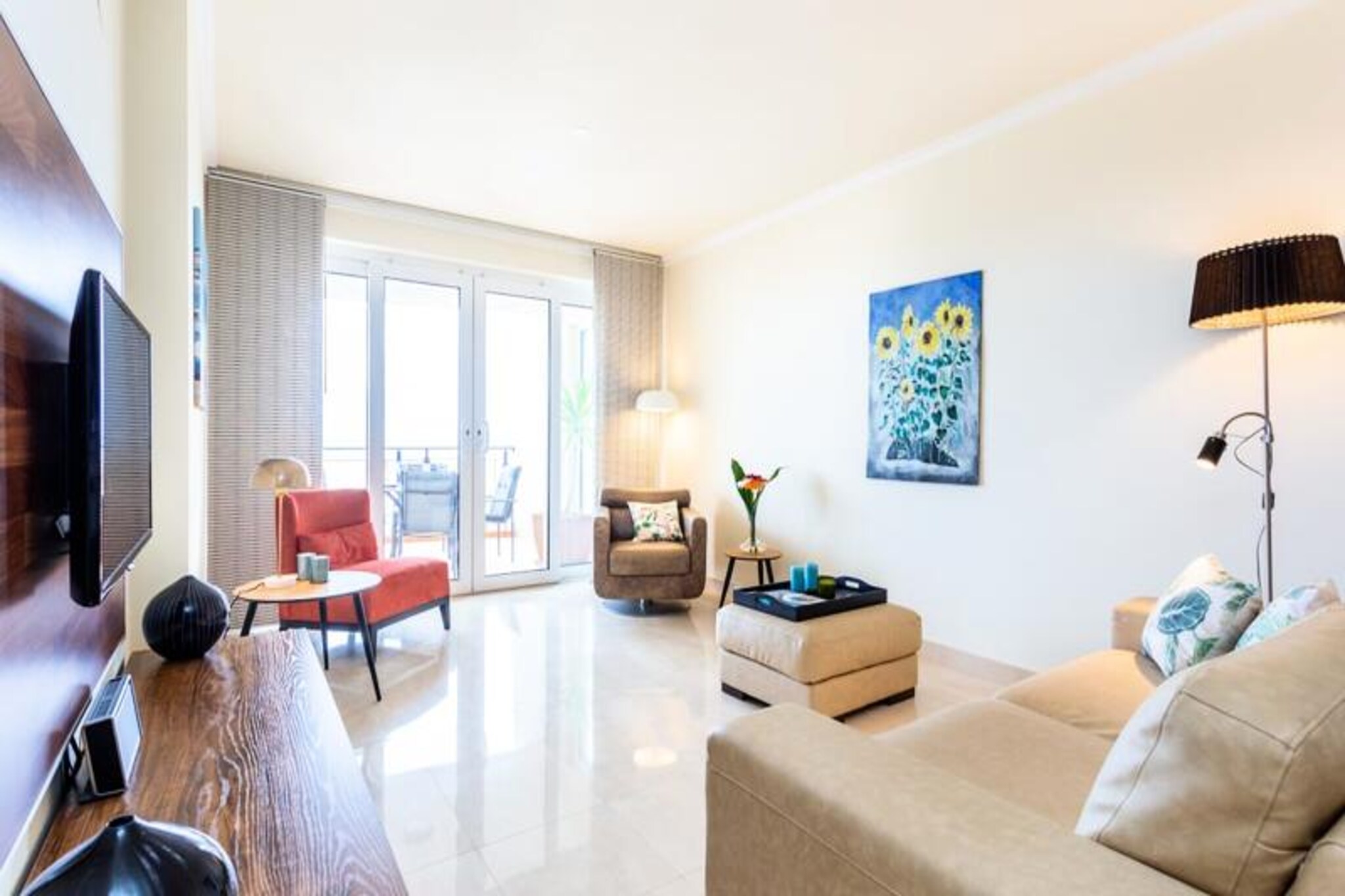 Imagine waking up to the soothing sound of waves and the endless horizon of the Atlantic Ocean stretching before you. This luxurious 2-bedroom, 2-bathroom apartment is a true seaside haven, perfectly situated just steps from the golden sands of Meia Praia beach in Lagos. With its modern design and elegant interiors, this property offers a serene escape for families or couples seeking a blend of comfort and breathtaking views. Whether you're enjoying your morning coffee on the spacious private balcony or taking a dip in the rooftop pool, every moment here feels like a celebration of coastal beauty. 

The apartment is thoughtfully designed to cater to your every need. The open-plan kitchen and living area are bathed in natural light, with large windows framing the stunning sea views. Both bedrooms are cozy yet sophisticated, while the bathrooms, renovated in 2020, feature sleek walk-in showers. The building also boasts a solar-heated rooftop pool and sun terrace, providing the perfect spot to unwind after a day of exploring. With Wi-Fi, television, and all linens provided, your stay promises to be as convenient as it is relaxing.

Beyond the apartment, the vibrant town of Lagos awaits. A 15-minute walk takes you to the marina, where you'll find lively bars, restaurants, and shops. From here, cross the bridge to the historic city center, known for its charming streets, local markets, and delicious cuisine. For adventure seekers, the dramatic cliffs and caves of the Algarve coastline are best explored by boat, kayak, or paddleboard. Meia Praia itself offers a variety of beachfront dining options, while the nearby Vila Galé complex provides spa and gym facilities for a touch of indulgence.

Whether you're here to relax by the sea, explore the rich history of Lagos, or embark on thrilling water sports, this apartment is your perfect base. With Faro Airport just an hour away, your dream coastal getaway is closer than you think.