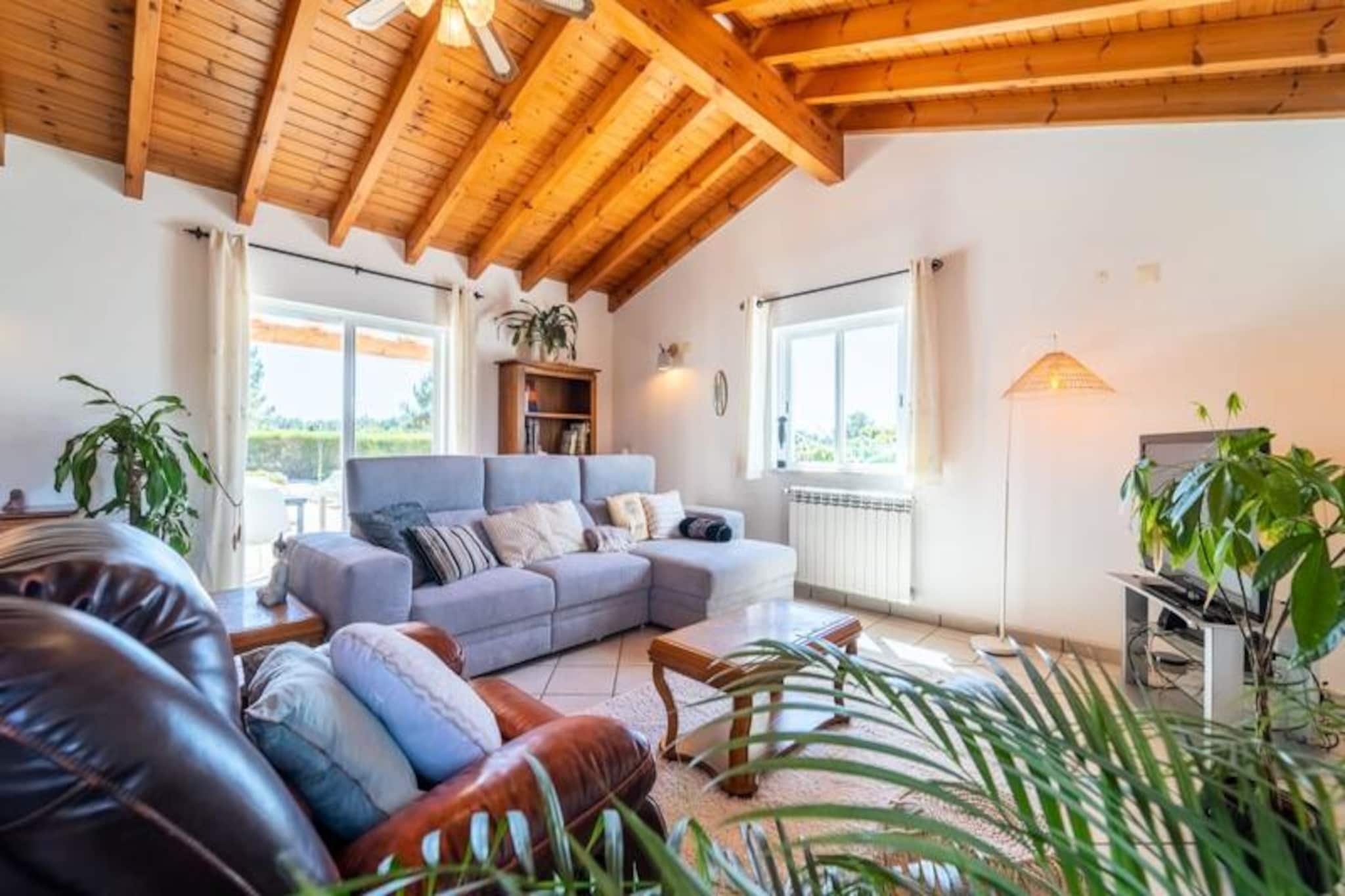 On the sun-drenched outskirts of Aljezur, this stunning villa offers a serene retreat for families and groups of up to eight guests. Surrounded by the natural beauty of the Costa Vicentina Nature Reserve, it’s a haven for those seeking tranquility without sacrificing convenience. Whether you’re lounging in the south-facing garden or exploring the nearby beaches, this villa promises an unforgettable escape.
Inside, the villa blends rustic charm with modern comfort. Four uniquely styled bedrooms, each featuring plush mattresses, ensure restful nights for all. With three bathrooms, including two en suites, there’s ample space and privacy for everyone. The open-plan living area invites you to unwind, while the fully equipped kitchen makes preparing meals a joy. High-speed Laser Wi-Fi and a Smart TV add to the modern conveniences, ensuring a comfortable stay.
Step outside to discover a private paradise. The saltwater pool, complete with a child-safe cover, is perfect for sunny days. A pergola with a hammock, a swing, a trampoline, and an outdoor kitchen with a barbecue create a space designed for relaxation and fun. The large fenced garden offers peace of mind for families with children.
Located in Vale da Telha, this villa is perfectly positioned between the famous Arrifana surf beach and the tranquil Monte Clérigo beach. The historic town of Aljezur is just a 15-minute drive away, offering shops, restaurants, and cultural charm. For those looking to explore further, Lagos is a mere 35 minutes away, and Faro Airport is an 80-minute drive. Whether you’re here to surf, hike, or simply relax, this villa is your gateway to the best of Portugal’s Algarve coast.