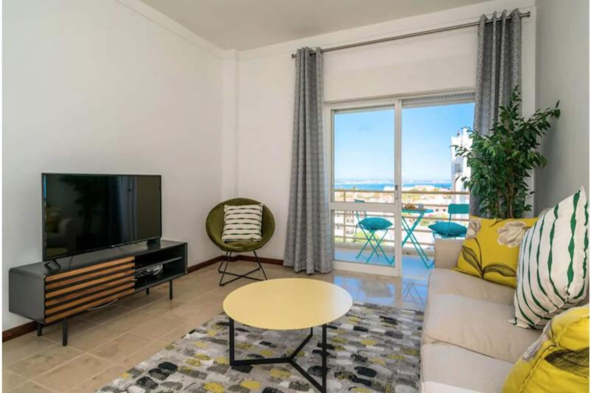 Awaken to the soothing sound of waves and the endless blue horizon from this inviting two-bedroom apartment in Lagos, Portugal. Perfectly situated on the third floor, this property offers breathtaking sea views from its private balconies, making it an ideal retreat for those seeking tranquility and natural beauty. Just a short 10-minute stroll will lead you to the historic Old Town of Lagos, where cobblestone streets, charming cafes, and centuries-old city walls await exploration. For beach lovers, two of the Algarve's most stunning beaches, Praia Dona Ana and Porto de Mos, are within a 20-minute walk. 
 
 The apartment is thoughtfully designed to combine comfort and functionality. The master bedroom features a plush double bed and a private balcony, where you can unwind with views of Meia Praia beach. The second bedroom, with two single beds, opens onto a larger balcony, perfect for enjoying the fresh sea breeze. The modern living and dining area, recently renovated, is bathed in natural light and leads to yet another balcony with stunning ocean vistas. A fully equipped kitchen, Wi-Fi, television, and provided linens and towels ensure a hassle-free stay. 
 
 Step outside, and you'll find local cafes, restaurants, and a bakery just moments away, offering a taste of traditional Portuguese cuisine. A small supermarket is also within walking distance for added convenience. For the adventurous, the Algarve offers a wealth of activities, from hiking along dramatic cliffs to exploring water parks, historical landmarks, and world-class golf courses. Surfing enthusiasts will appreciate the nearby west coast, renowned for its excellent waves. 
 
 Whether you're here to relax by the sea, immerse yourself in local culture, or embark on outdoor adventures, this apartment is your gateway to an unforgettable Algarve experience. Let the charm of Lagos and the comfort of this coastal haven create memories to last a lifetime.