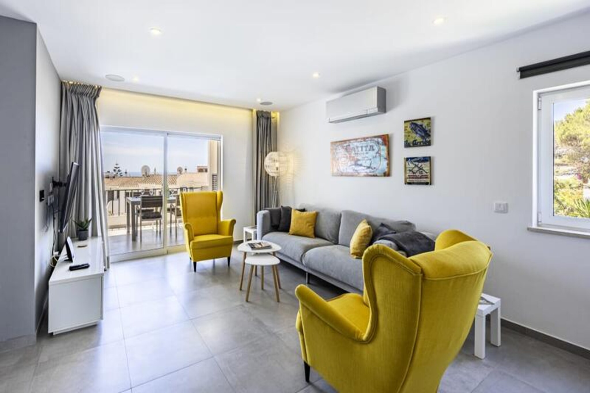 Wake up to the soothing sounds of the Atlantic and the golden hues of the Algarve sun in this charming two-bedroom apartment in Praia da Luz. Located in the heart of this picturesque coastal town, the apartment offers a serene retreat just steps from the vibrant local life and stunning beaches. Whether you're sipping your morning coffee on the spacious balcony or unwinding with a glass of wine as the sun sets, the ocean views will captivate your senses.
Inside, the apartment combines modern comfort with coastal charm. The open-plan living area is flooded with natural light, featuring a lounge, dining space, and a fully equipped kitchen with sleek appliances and ample workspace for culinary enthusiasts. The master bedroom, with its plush bedding and ocean-facing windows, ensures a restful night's sleep, while the second bedroom with twin beds is perfect for additional guests. Two bathrooms, including one en suite, provide convenience and privacy for all.
Step outside, and you'll find yourself surrounded by the best Praia da Luz has to offer. Stroll along the sandy beach, enjoy fresh seafood at seaside cafes, or explore the quaint shops and local markets. For those seeking adventure, the nearby cliffside trails offer breathtaking coastal views, while the historic city of Lagos and the charming fishing village of Burgau are just a short drive away.
With its unbeatable location, modern amenities, and warm ambiance, this apartment is your perfect home base for an unforgettable Algarve getaway. Whether you're here to relax, explore, or indulge in the region's rich culture, Praia da Luz welcomes you with open arms.
